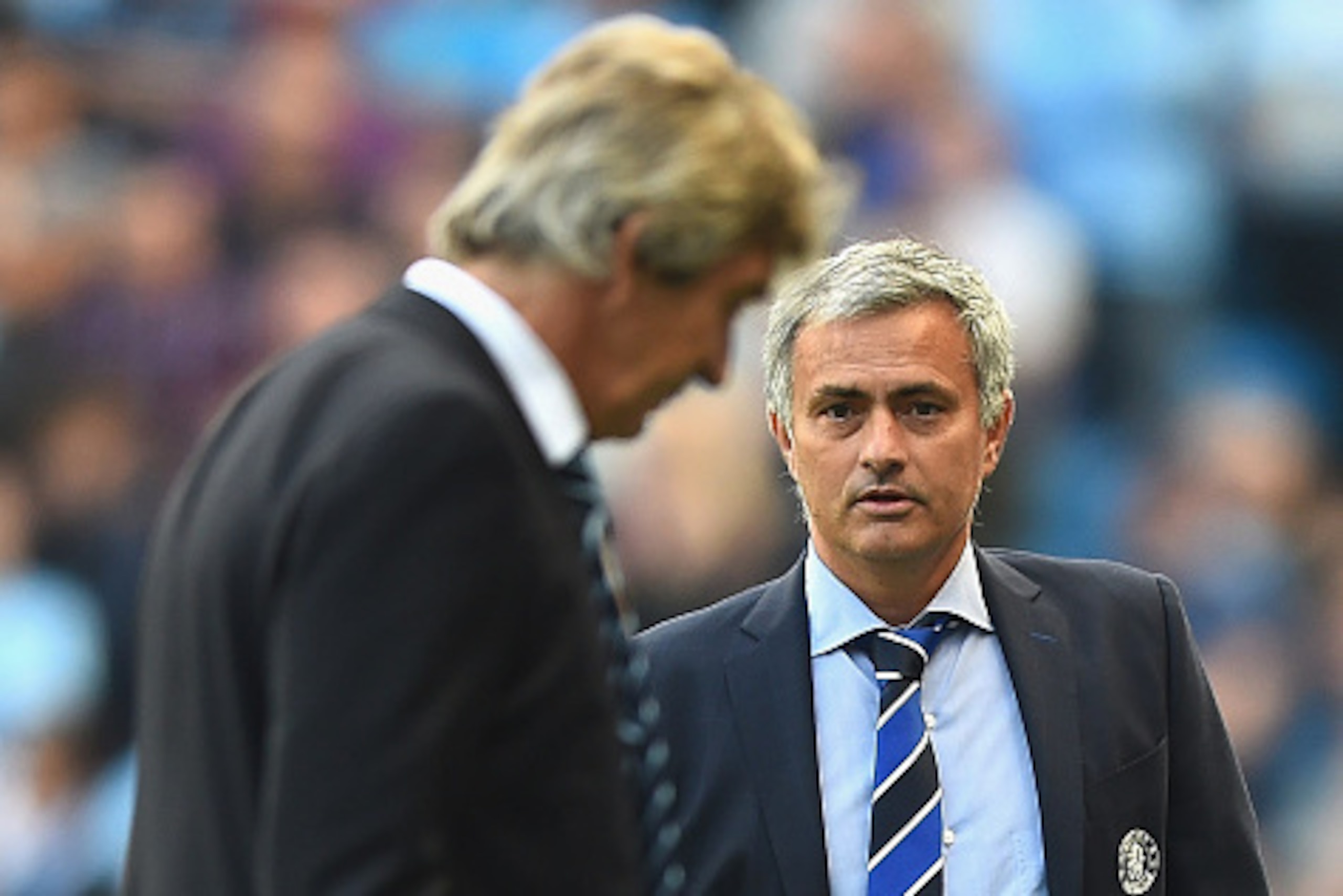 MANCHESTER, ENGLAND - SEPTEMBER 21:  Jose Mourinho of Chelsea looks to Manuel Pellegrini of Manchester City during the Barclays Premier League match between Manchester City and Chelsea at Etihad Stadium on September 21, 2014 in Manchester, England.  (Phot