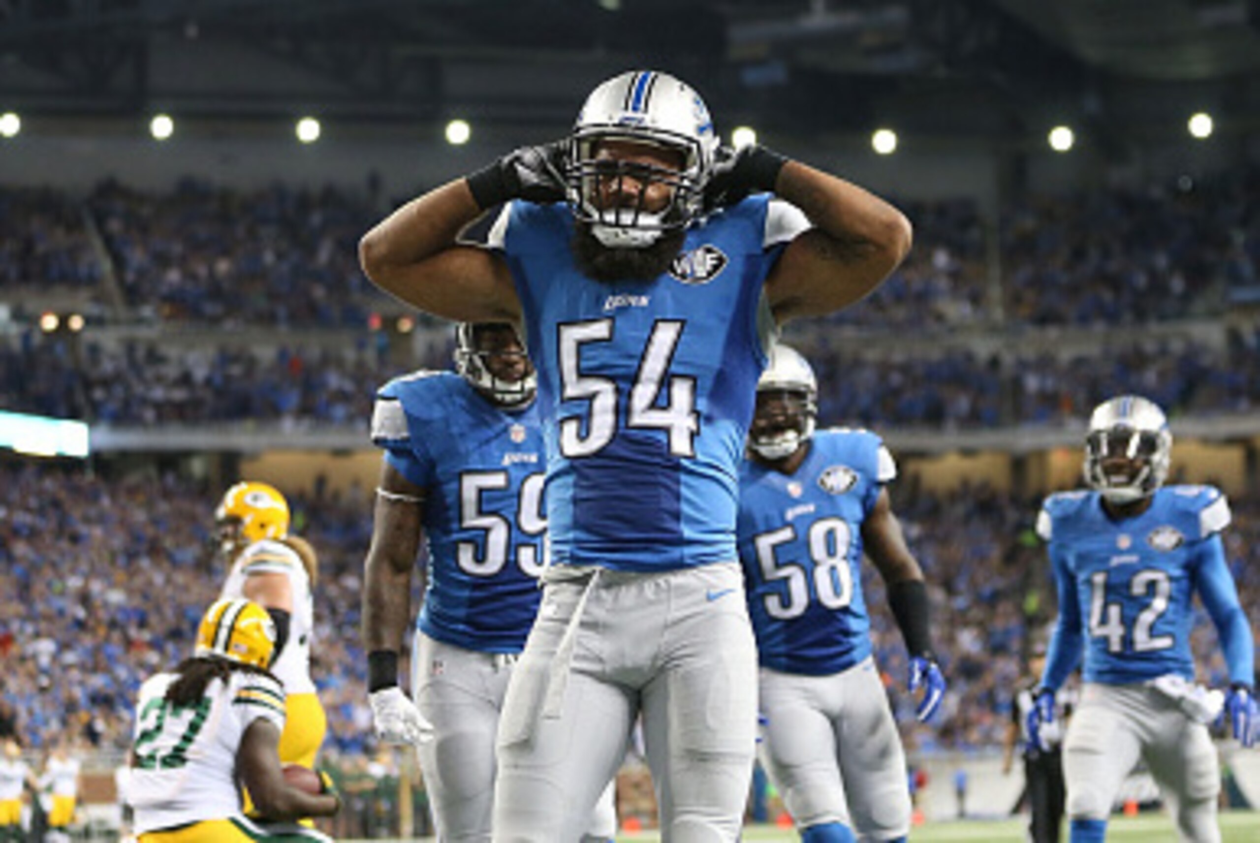 DETROIT, MI - SEPTEMBER 21: DeAndre Levy #54 of the Detroit Lions celebrates after tackling Eddie Lacy #27 of the Green Bay Packers for a safety during the second quarter of the game at Ford Field on September 21, 2014 in Detroit, Michigan.  (Photo by Leo