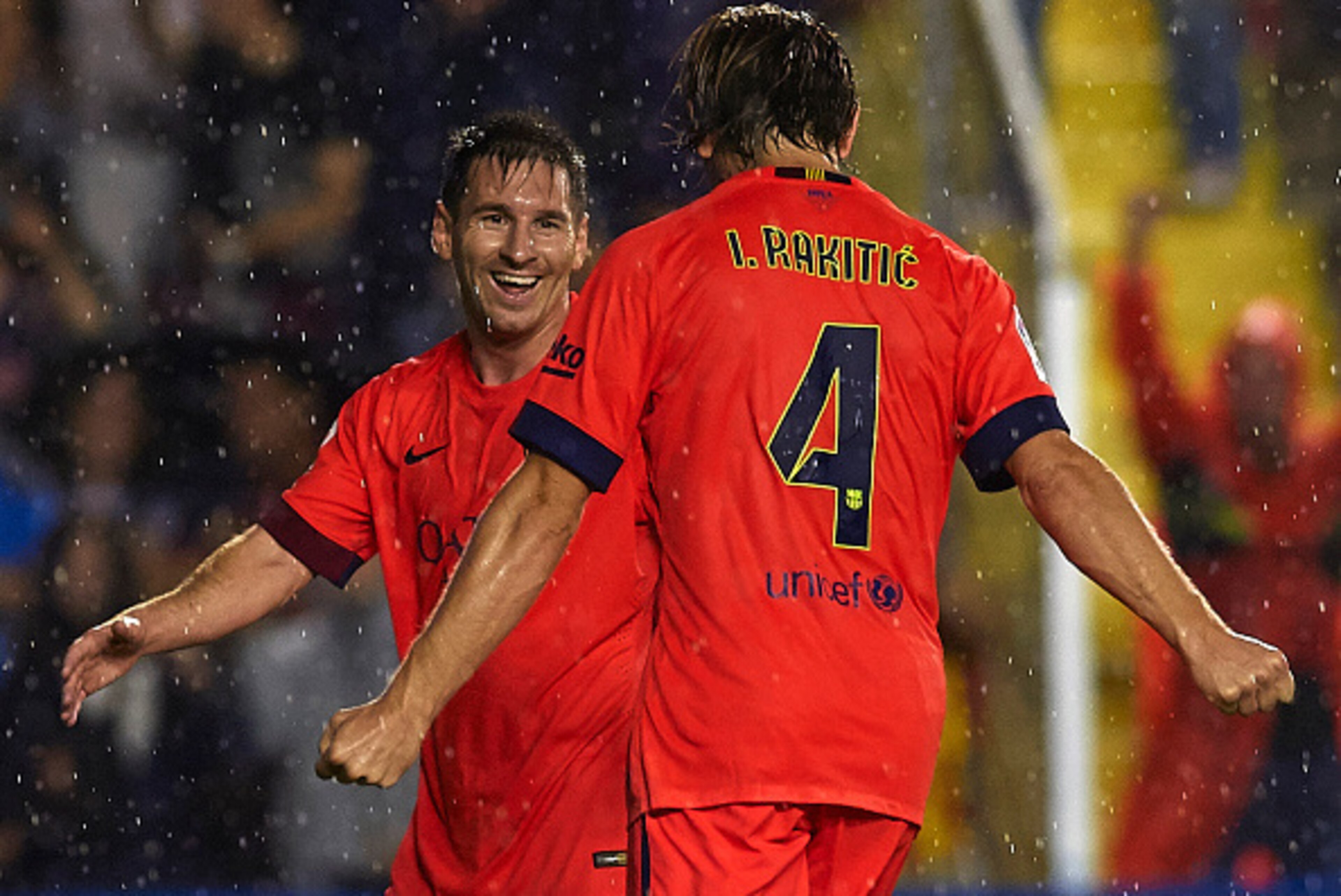VALENCIA, SPAIN - SEPTEMBER 21:  Ivan Rakitic of Barcelona celebrates scoring with his teammate Lionel Messi during the La Liga match between Levante UD and FC Barcelona at Ciutat de Valencia on September 21, 2014 in Valencia, Spain.  (Photo by Manuel Que