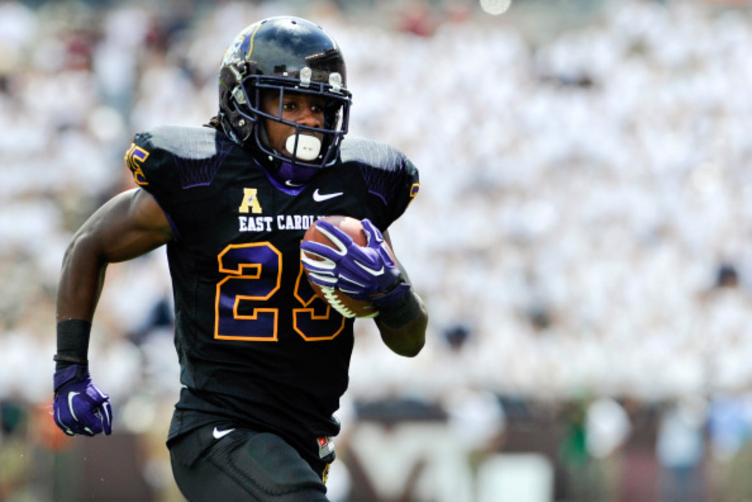 BLACKSBURG, VA - SEPTEMBER 13: Running back Breon Allen #25 of the East Carolina Pirates rushes in the first half against the Virginia Tech Hokies at Lane Stadium on September 13, 2014 in Blacksburg, Virginia. East Carolina defeated Virginia Tech 28-21.  