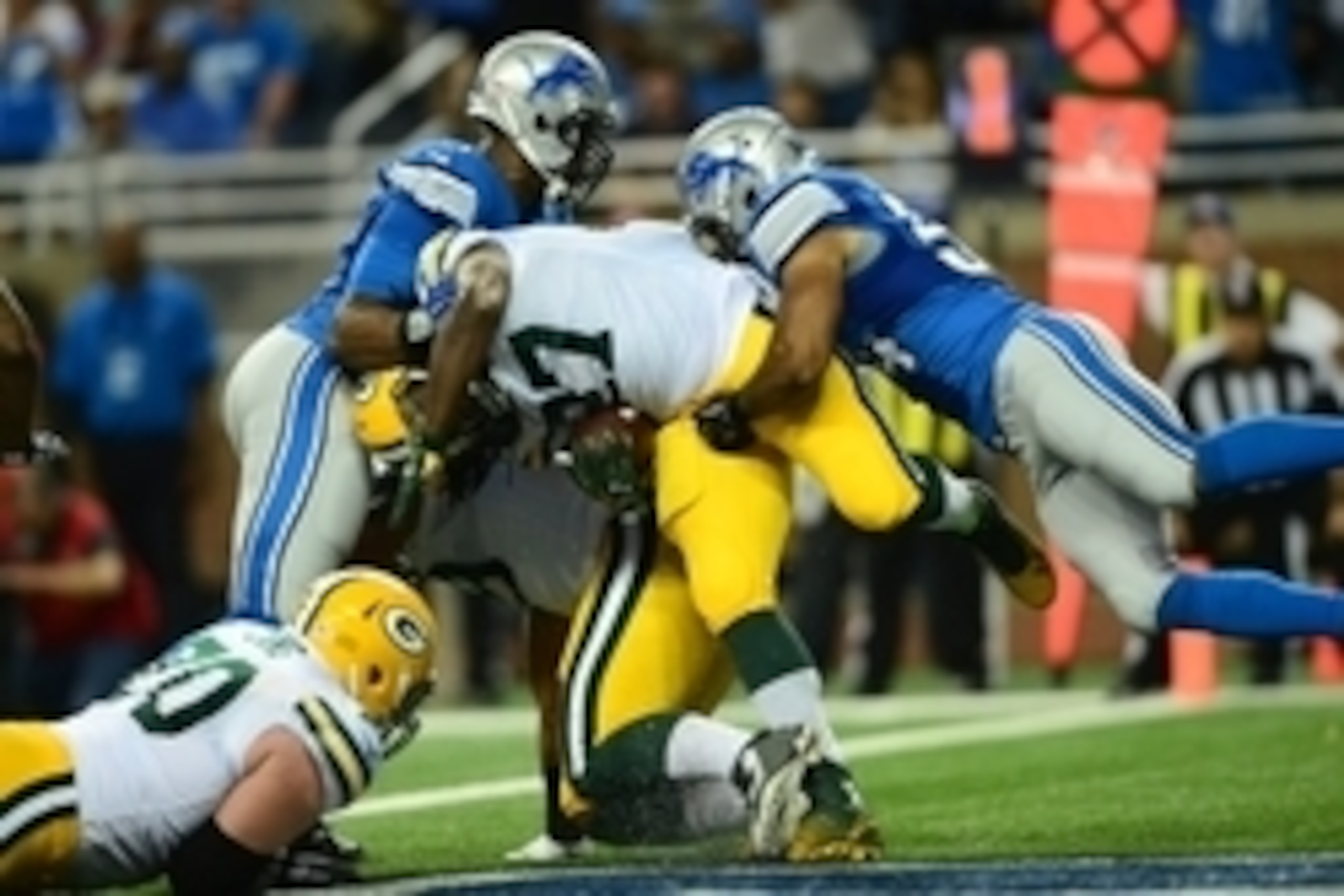 Sep 21, 2014; Detroit, MI, USA; Detroit Lions outside linebacker DeAndre Levy (54) tackles Green Bay Packers running back Eddie Lacy (27) in the end zone for a safety during the second quarter at Ford Field. Mandatory Credit: Andrew Weber-USA TODAY Sports