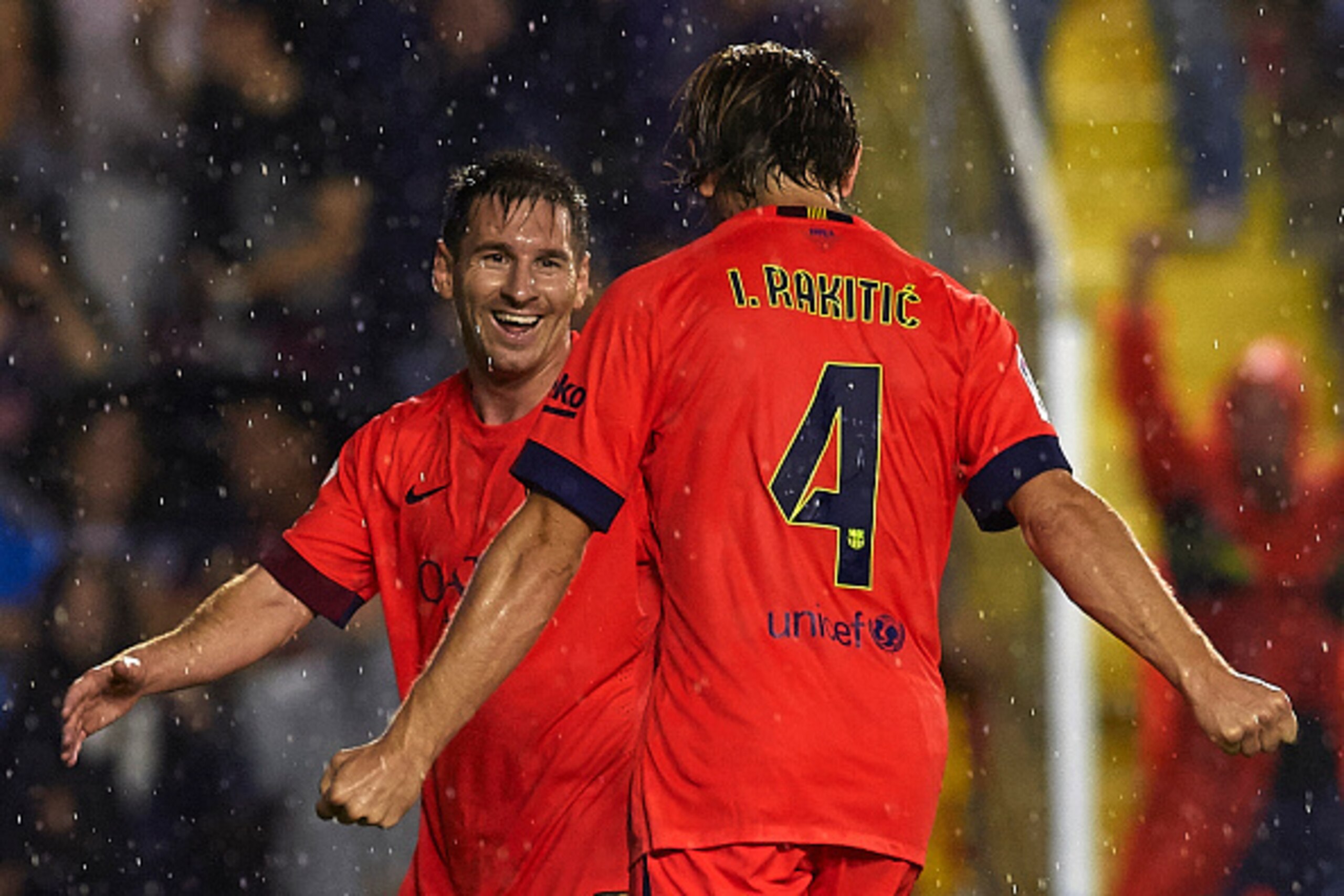 VALENCIA, SPAIN - SEPTEMBER 21:  Ivan Rakitic of Barcelona celebrates scoring with his teammate Lionel Messi during the La Liga match between Levante UD and FC Barcelona at Ciutat de Valencia on September 21, 2014 in Valencia, Spain.  (Photo by Manuel Que
