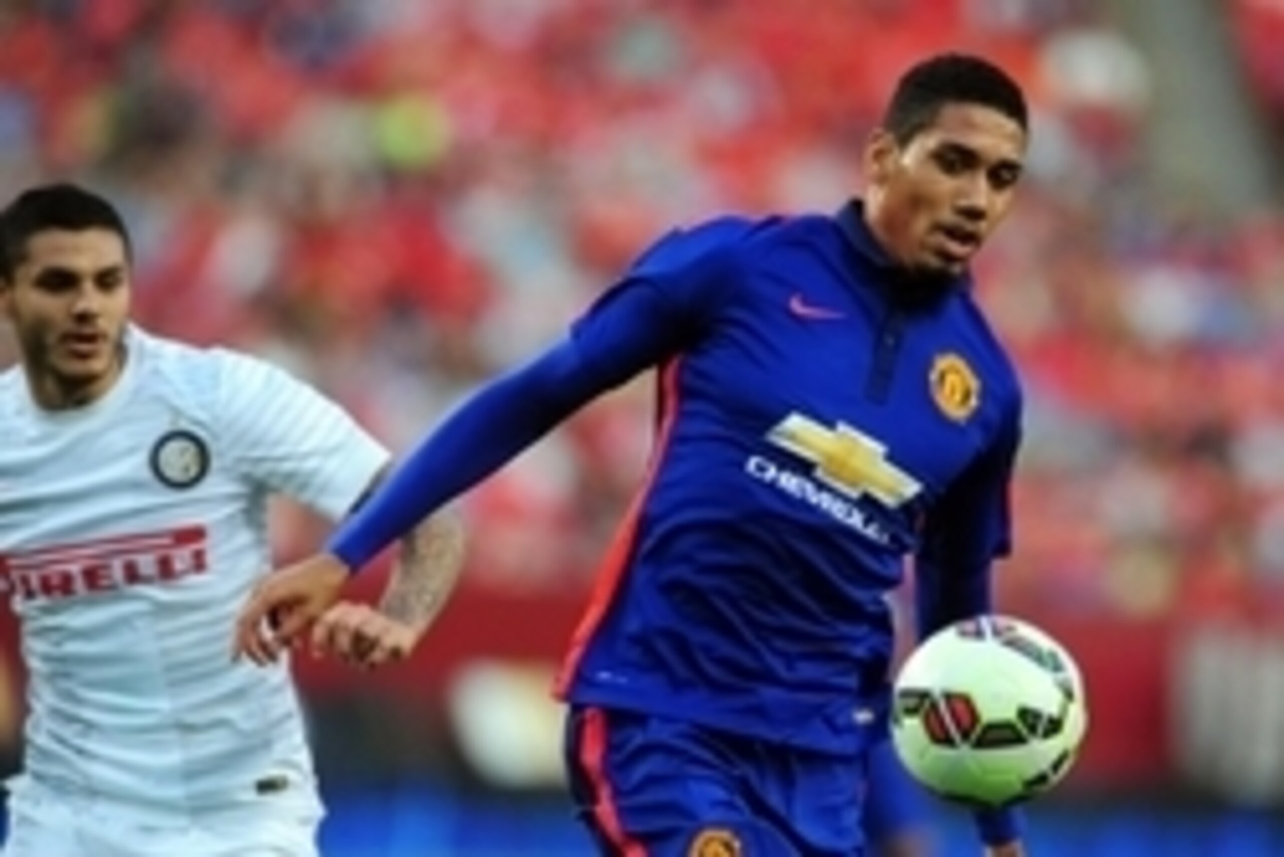 Jul 29, 2014; Landover, MD, USA; Manchester United defenseman Chris Smalling (12) fights for the ball with Inter Milan forward Mauro Icardi (9) in the first half at FedEx Field. Mandatory Credit: Evan Habeeb-USA TODAY Sports Jul 29, 2014; Landover, MD, USA; Manchester United defenseman Chris Smalling (12) fights for the ball with Inter Milan forward Mauro Icardi (9) in the first half at FedEx Field. Mandatory Credit: Evan Habeeb-USA TODAY Sports