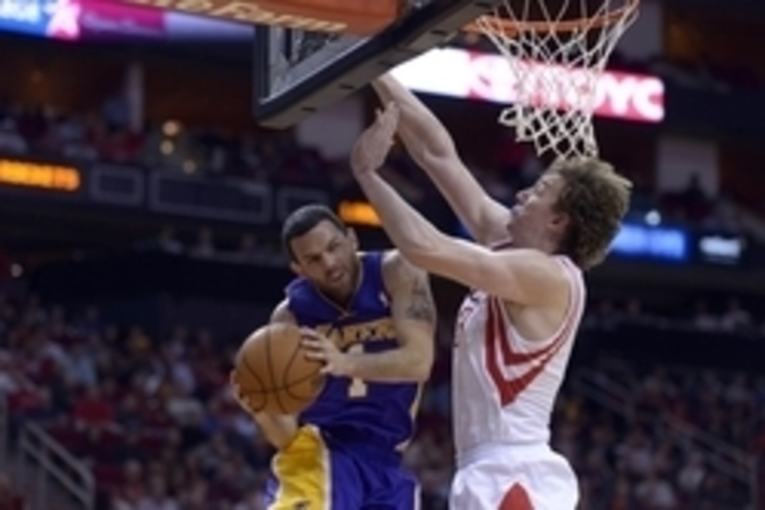 Nov 7, 2013; Houston, TX, USA; Los Angeles Lakers point guard Jordan Farmar (1) drives against Houston Rockets center Omer Asik (3) during the second half at Toyota Center. The Lakers won 99-98. Mandatory Credit: Thomas Campbell-USA TODAY Sports