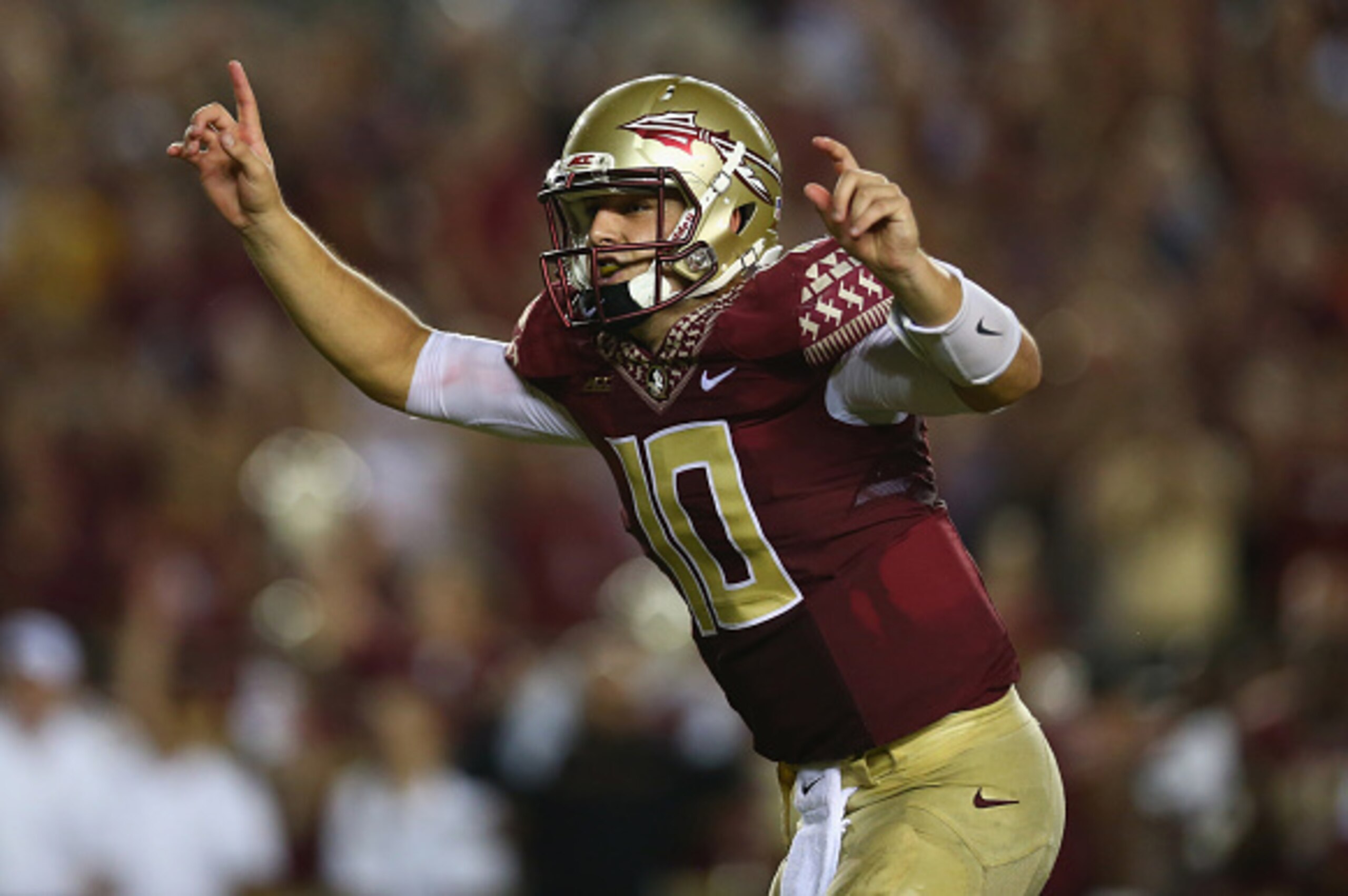 TALLAHASSEE, FL - SEPTEMBER 20:  Sean Maguire #10 of the Florida State Seminoles celebrates the overtime win against the Clemson Tigers at Doak Campbell Stadium on September 20, 2014 in Tallahassee, Florida.  (Photo by Ronald Martinez/Getty Images)