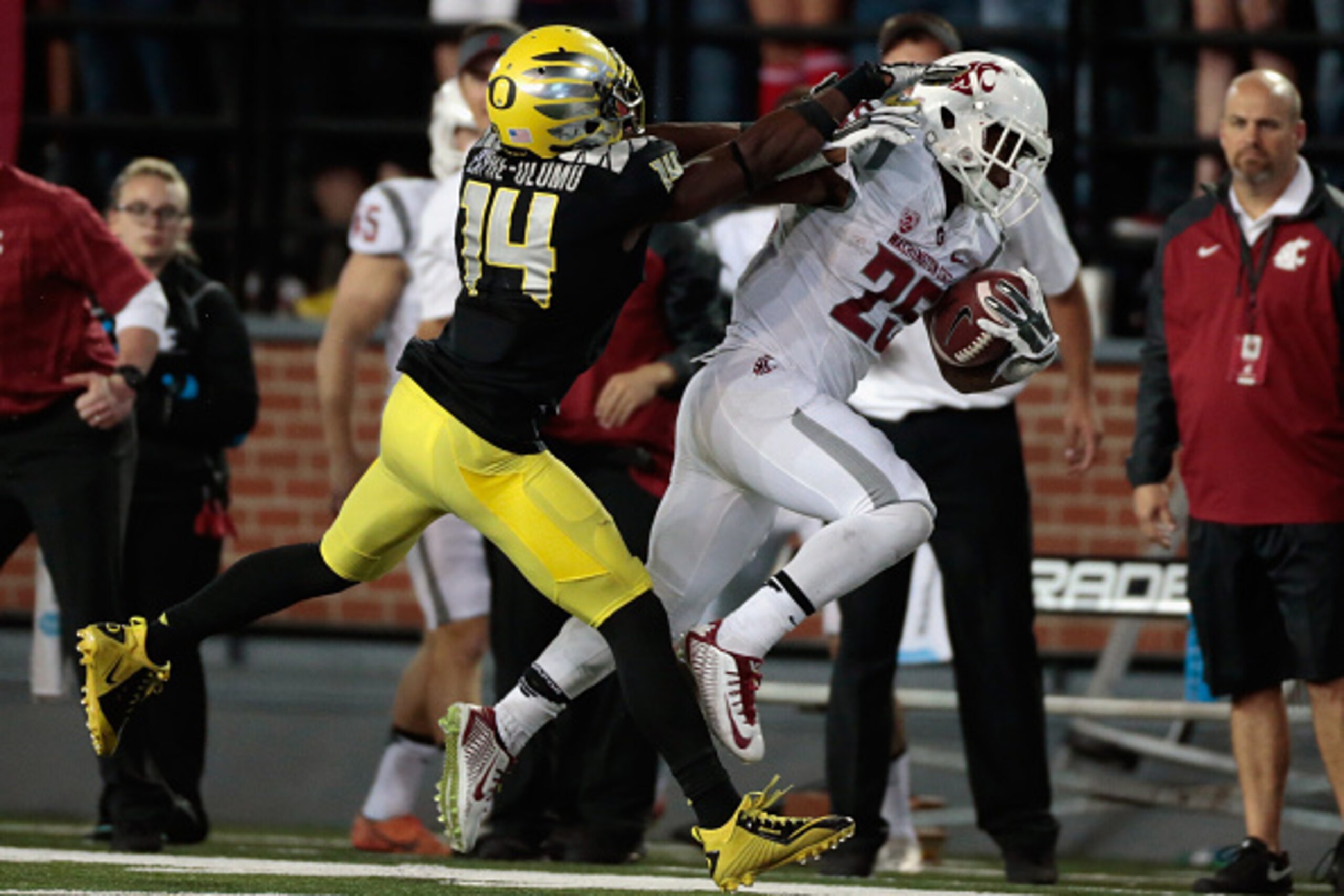 PULLMAN, WA - SEPTEMBER 20:  Jamal Morrow #25 of the Washington State Cougars is pushed out of bounds by Ifo Ekpre-Olomu #14 of the Oregon Ducks during the game at Martin Stadium on September 20, 2014 in Pullman, Washington.  Oregon defeated Washington St