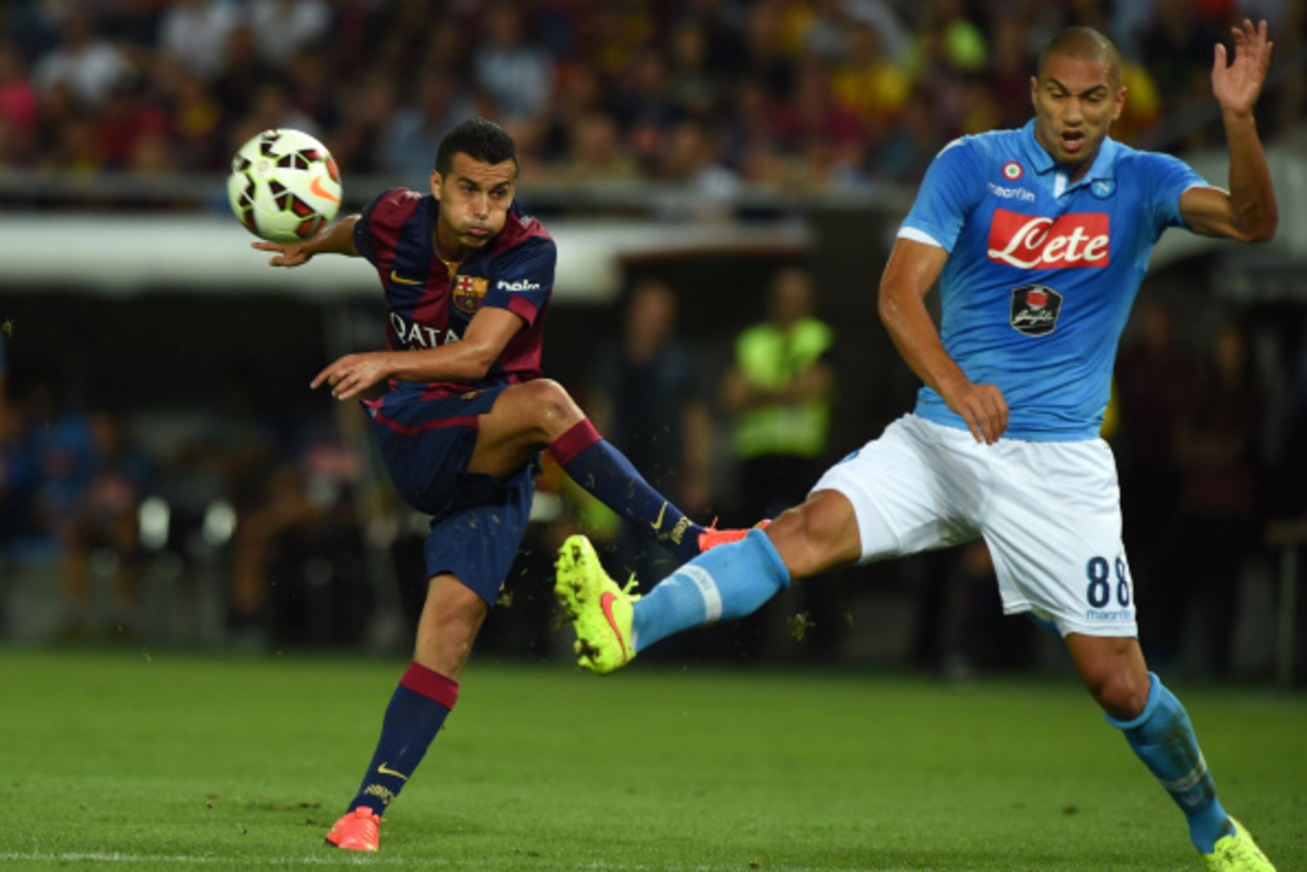 GENEVA, SWITZERLAND - AUGUST 06:  Pedro Rodriguez (L) of FC Barcelona in action against Gokhan Inler of SSC Napoli during the pre-season friendly match between FC Barcelona and SSC Napoli on August 6, 2014 in Geneva, Switzerland.  (Photo by Valerio Pennic