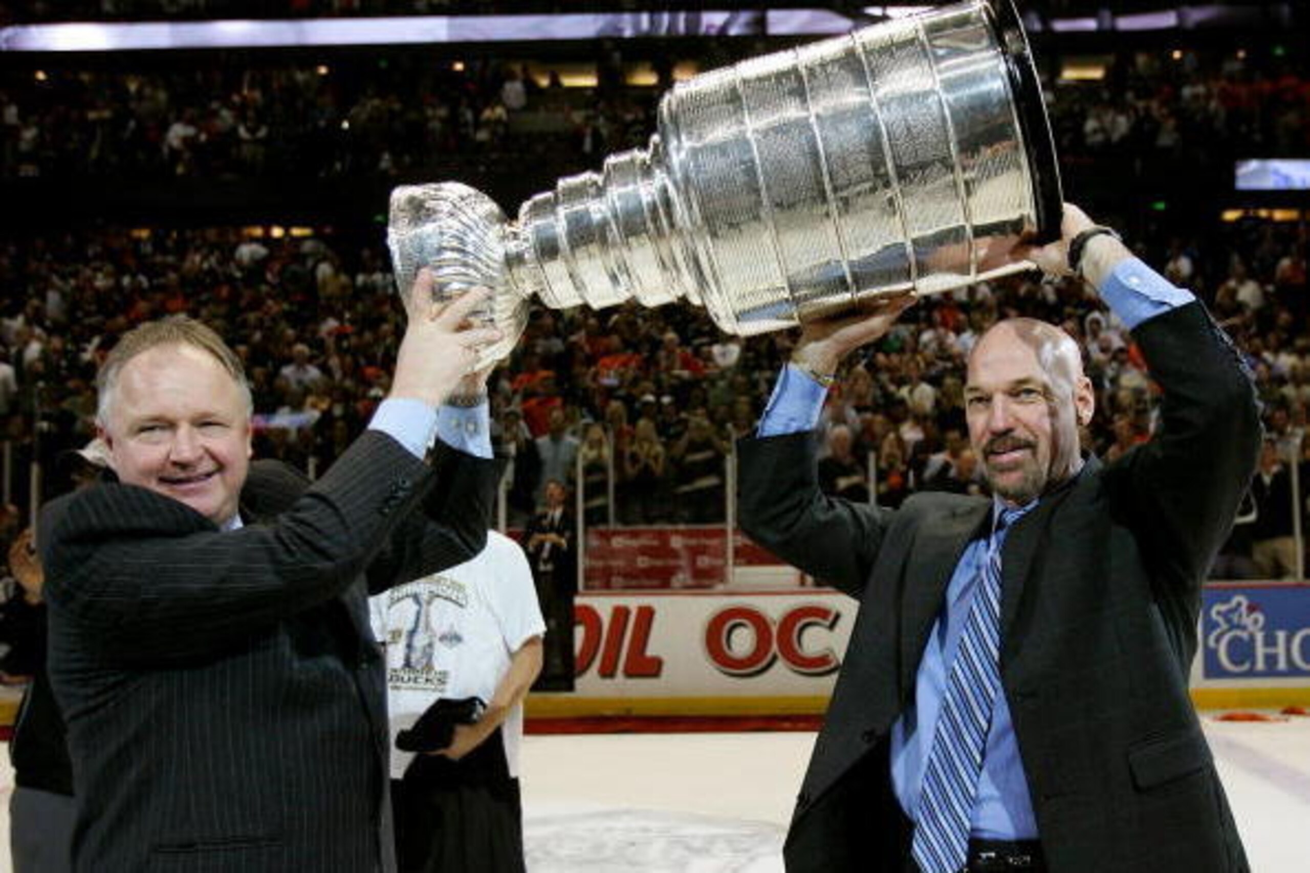 ANAHEIM, CA - JUNE 06:  Head coach Randy Carlyle of the Anaheim Ducks and assistant coach Dave Farrish hoist the Stanley Cup after their team's victory over the Ottawa Senators 6-2 during Game Five of the on June 6, 2007 at Honda Center in Anaheim, Califo