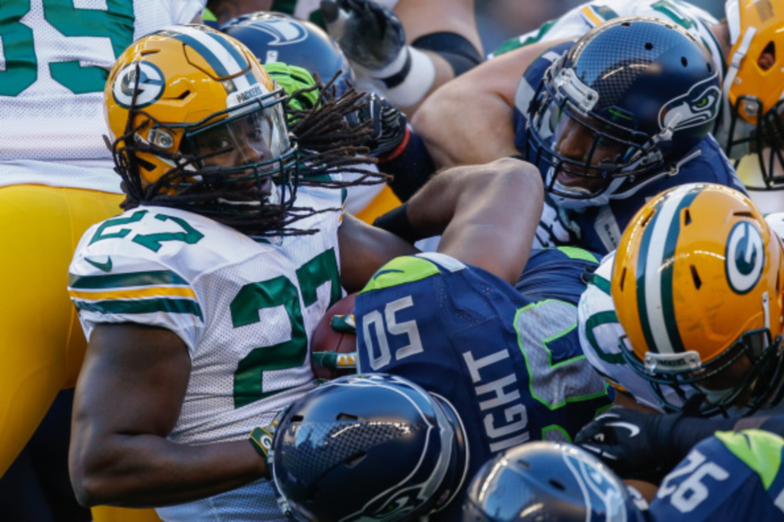 SEATTLE, WA - SEPTEMBER 04:  Running back Eddie Lacy #27 of the Green Bay Packers is tackled by outside linebacker K.J. Wright #50 of the Seattle Seahawks at CenturyLink Field on September 4, 2014 in Seattle, Washington.  (Photo by Otto Greule Jr/Getty Im