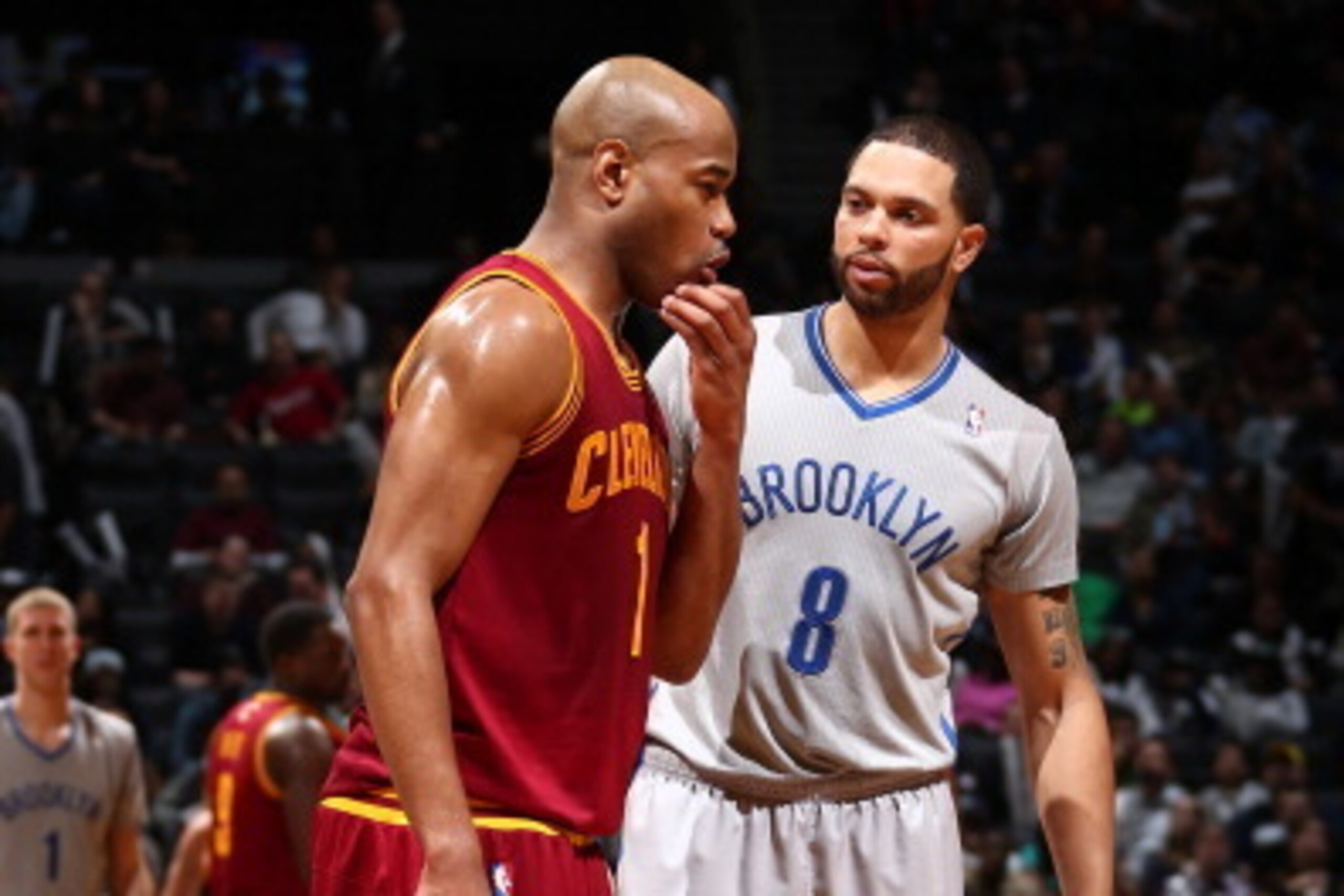 BROOKLYN, NY - MARCH 28: Deron Williams #8 of the Brooklyn Nets and Jarrett Jack #1 of the Cleveland Cavaliers talk during a game at the Barclays Center on March 28, 2014 in the Brooklyn borough of New York City.  NOTE TO USER: User expressly acknowledges
