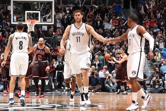 BROOKLYN, NY - APRIL 4: Brook Lopez #11 of the Brooklyn Nets celebrates with teammate Joe Johnson #7 in a game against the Chicago Bulls on April 4, 2013 at the Barclays Center in the Brooklyn borough of New York City.  NOTE TO USER: User expressly acknow