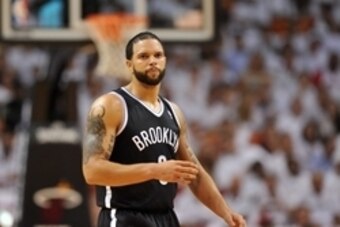 May 8, 2014; Miami, FL, USA; Brooklyn Nets guard Deron Williams (8) takes a breather during the second half in game two of the second round of the 2014 NBA Playoffs against the Miami Heat at American Airlines Arena. Miami won 94-82. Mandatory Credit: Stev
