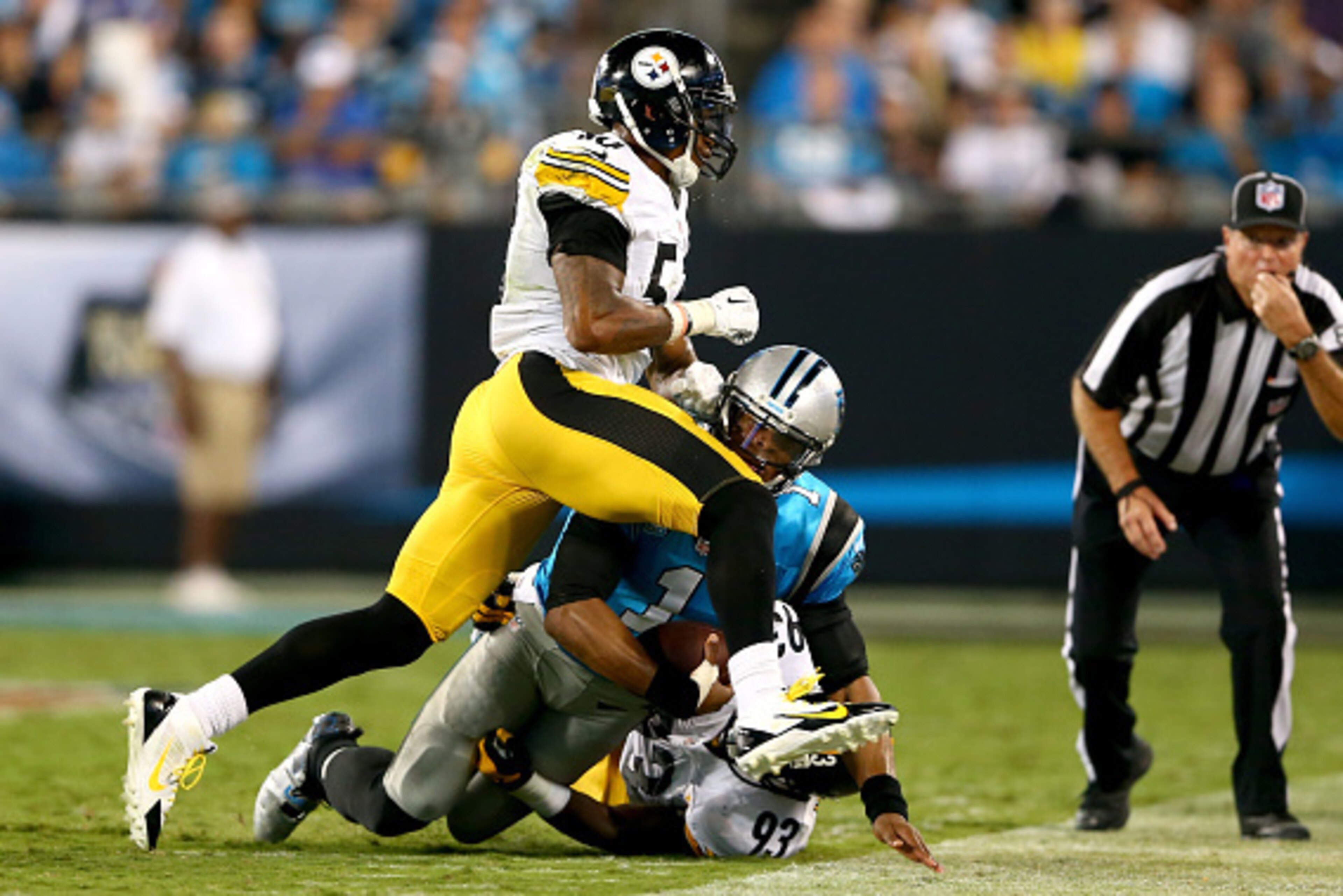 CHARLOTTE, NC - SEPTEMBER 21:  Teammates  Ryan Shazier #50 and Jason Worilds #93 of the Pittsburgh Steelers hit Cam Newton #1 of the Carolina Panthers during the game at Bank of America Stadium on September 21, 2014 in Charlotte, North Carolina.  (Photo b