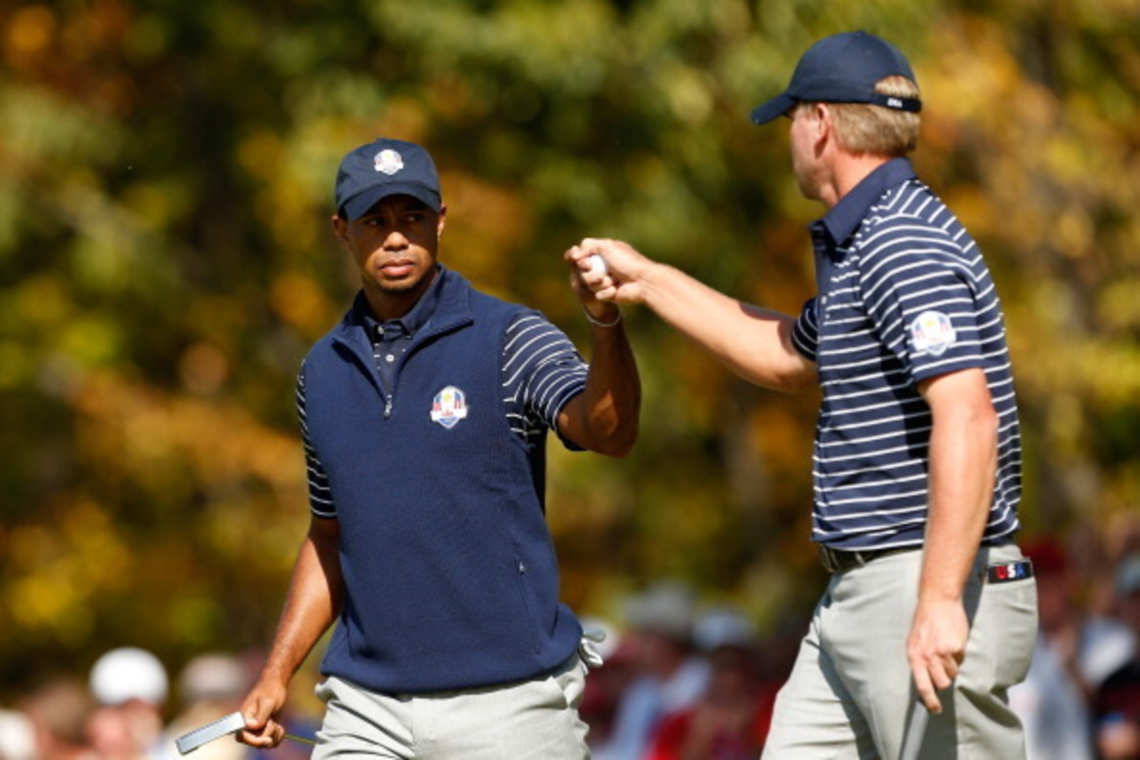 MEDINAH, IL - SEPTEMBER 29:  Tiger Woods and Steve Stricker of the USA celebrate on the fifth green during day two of the Afternoon Four-Ball Matches for The 39th Ryder Cup at Medinah Country Club on September 29, 2012 in Medinah, Illinois.  (Photo by Jam