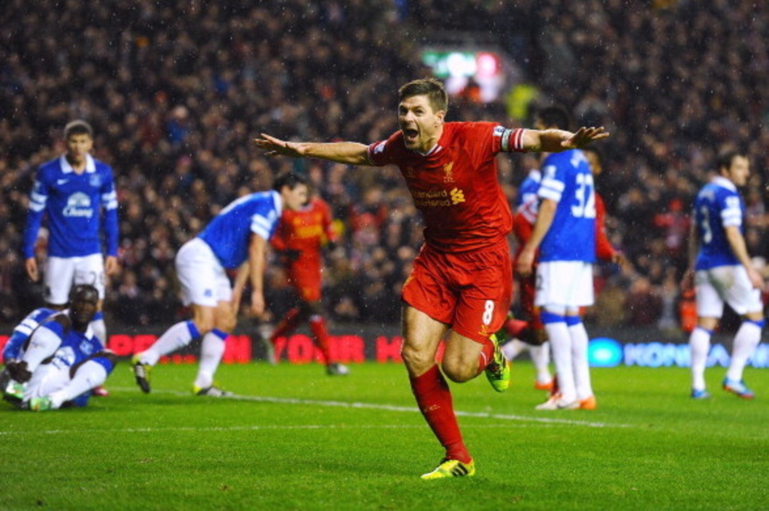 LIVERPOOL, ENGLAND - JANUARY 28:  Steven Gerrard of Liverpool celebrates after scoring the opening goal during the Barclays Premier League match between Liverpool and Everton at Anfield on January 28, 2014 in Liverpool, England.  (Photo by Laurence Griffi