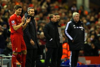 LIVERPOOL, ENGLAND - JANUARY 01:  Steven Gerrard of Liverpool prepares to replace Iago Aspas of Liverpool during the Barclays Premier League match between Liverpool and Hull City at Anfield on January 1, 2014 in Liverpool, England.  (Photo by Clive Brunsk