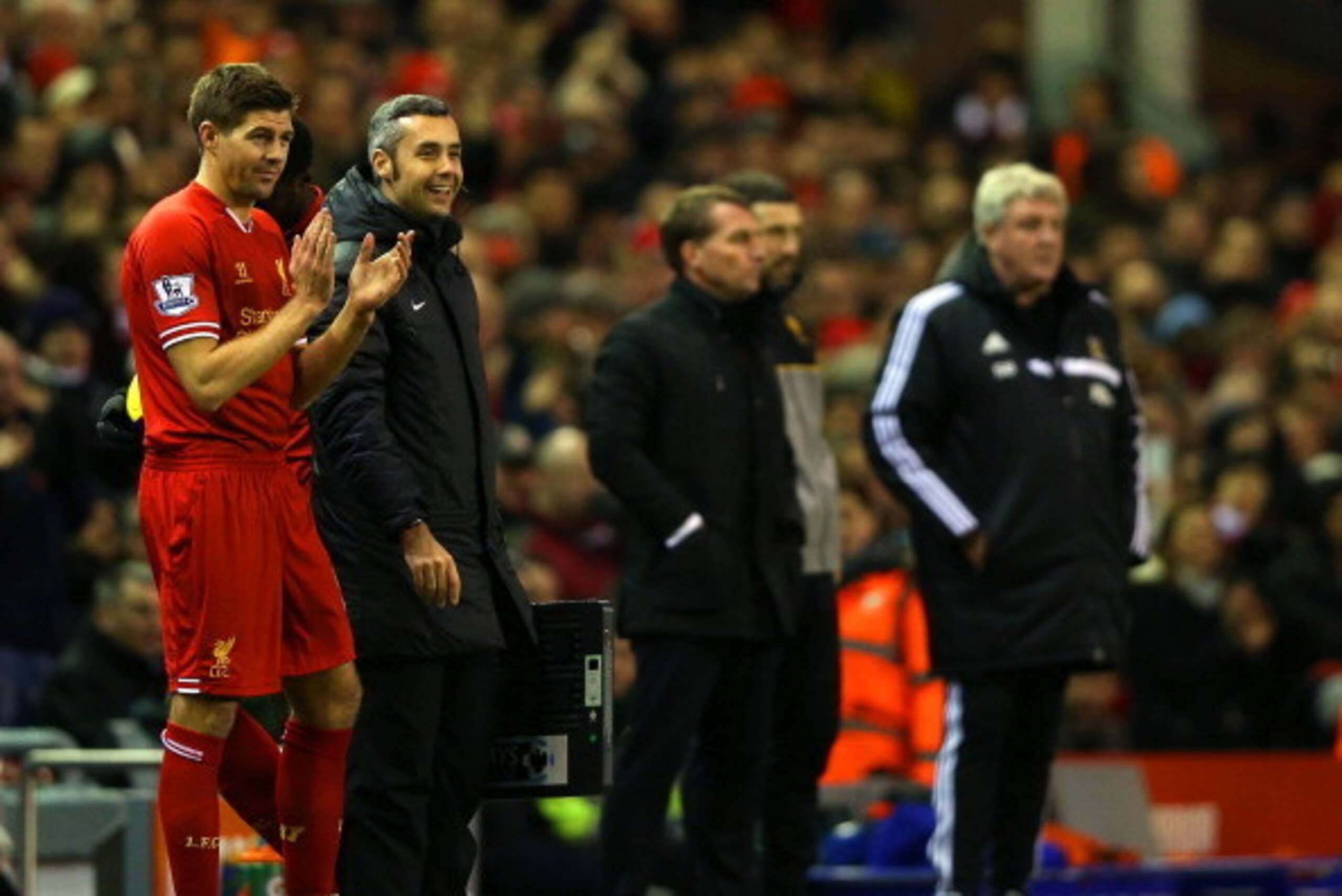 LIVERPOOL, ENGLAND - JANUARY 01:  Steven Gerrard of Liverpool prepares to replace Iago Aspas of Liverpool during the Barclays Premier League match between Liverpool and Hull City at Anfield on January 1, 2014 in Liverpool, England.  (Photo by Clive Brunsk