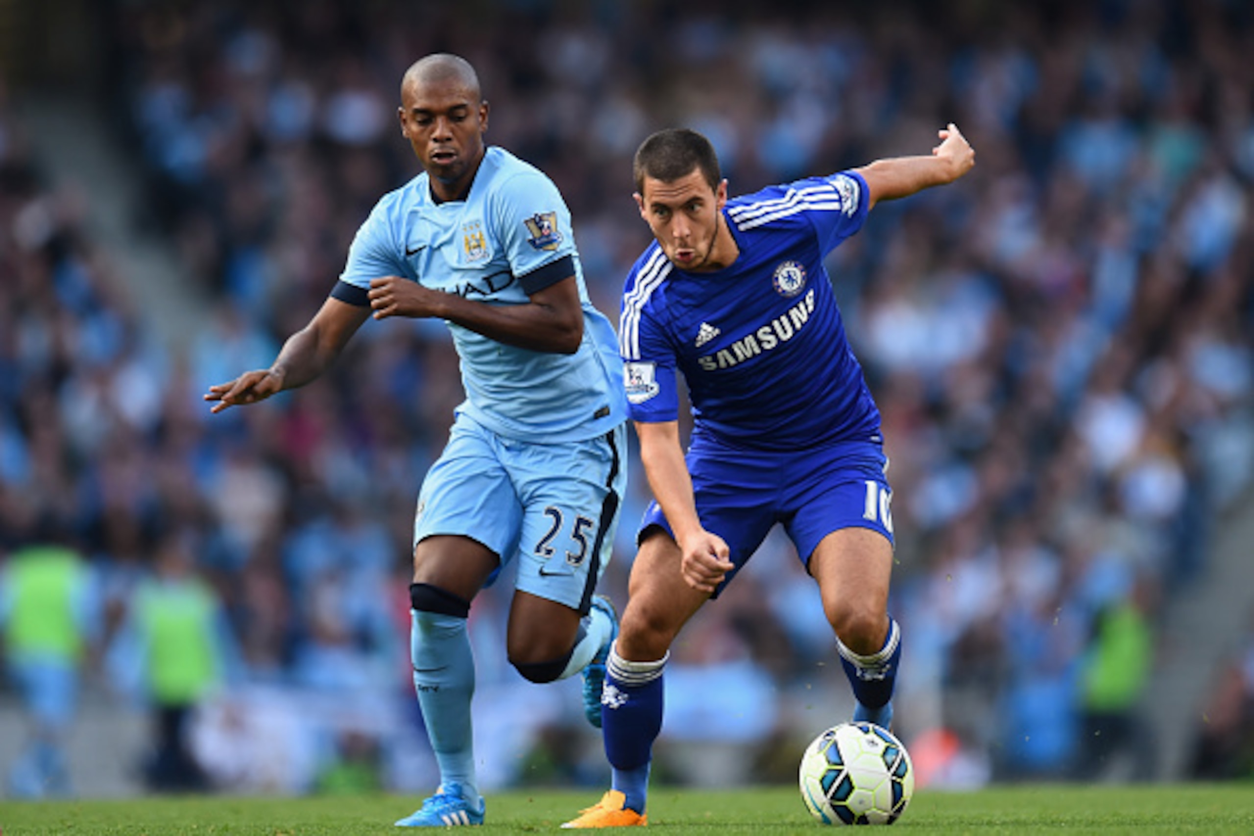MANCHESTER, ENGLAND - SEPTEMBER 21:  Eden Hazard of Chelsea competes with Fernandinho of Manchester City during the Barclays Premier League match between Manchester City and Chelsea at the Etihad Stadium on September 21, 2014 in Manchester, England.  (Pho