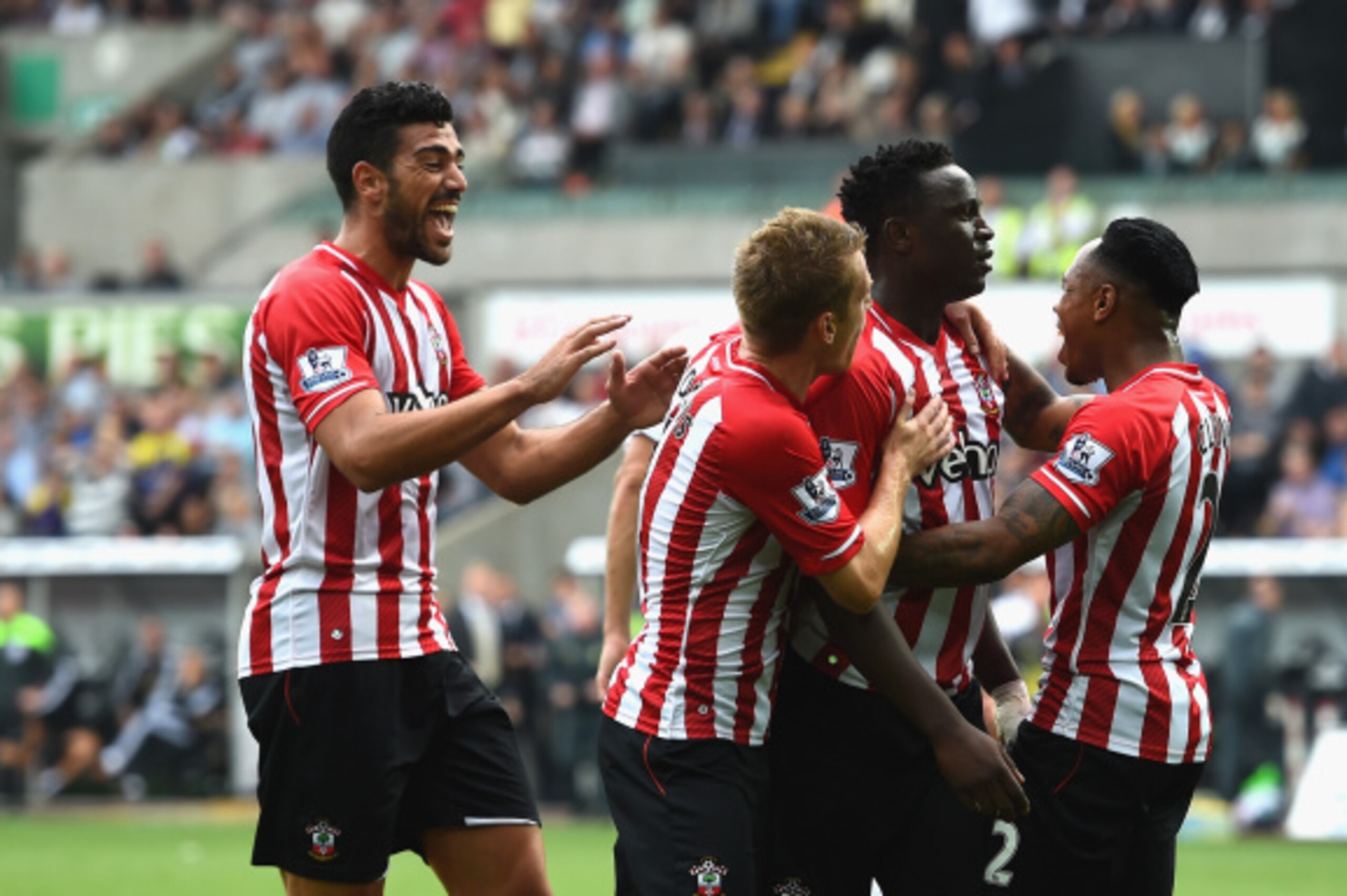 SWANSEA, WALES - SEPTEMBER 20:  Southampton player Victor Wanyama (2nd r) celebrates with team mates after scoring the first goal during the Barclays Premier League match between Swansea City and Southampton at Liberty Stadium on September 20, 2014 in Swa