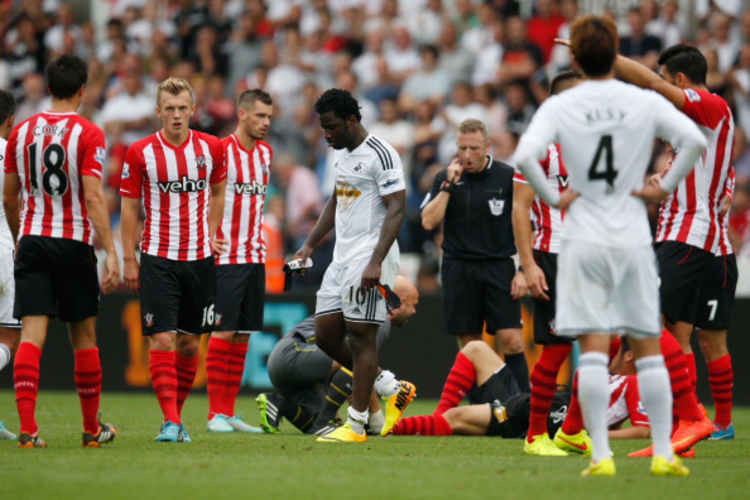 SWANSEA, WALES - SEPTEMBER 20:  Wilfried Bony of Swansea City walks off after being sent off during the Barclays Premier League match between Swansea City and Southampton at Liberty Stadium on September 20, 2014 in Swansea, Wales.  (Photo by Steve Bardens