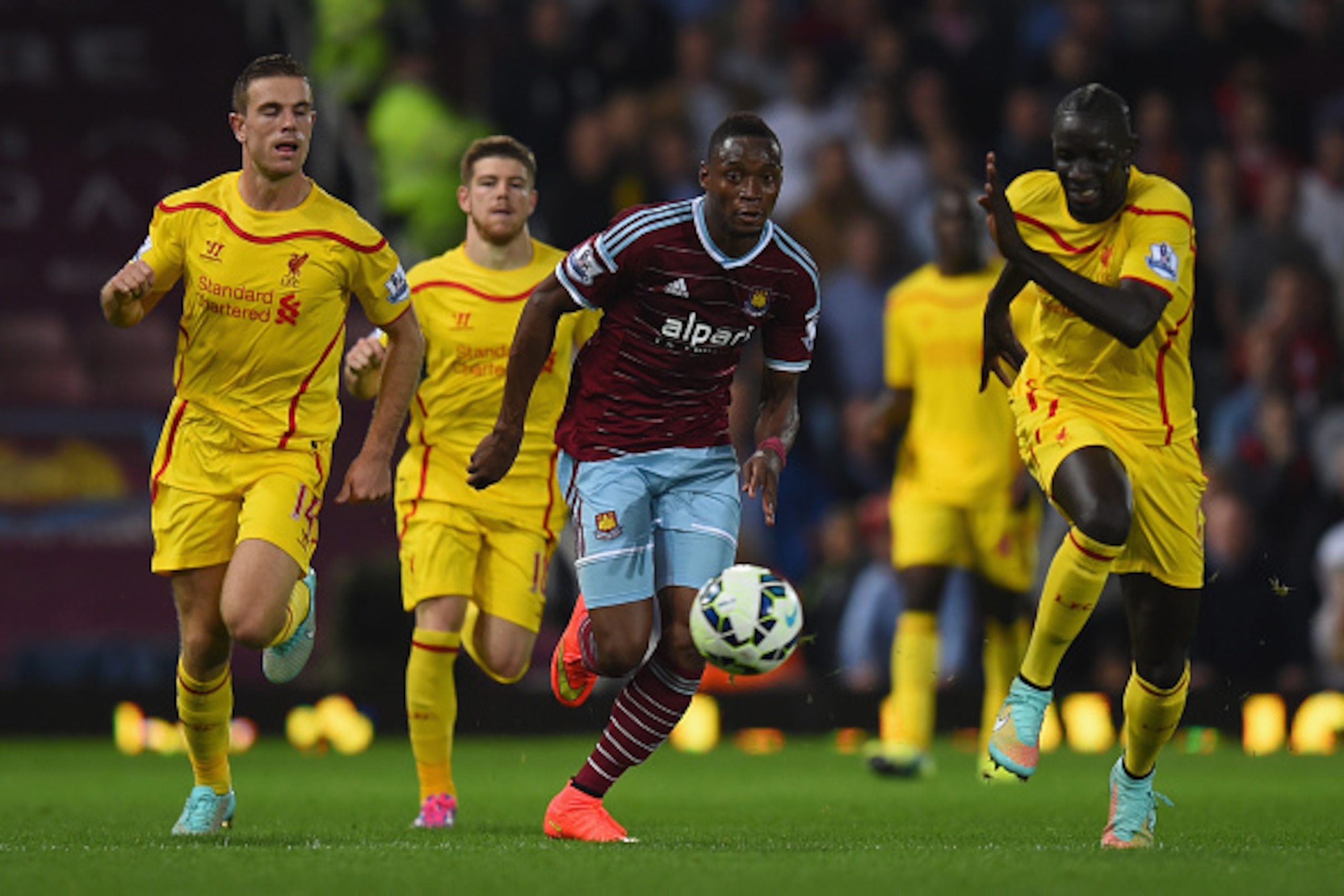 LONDON, ENGLAND - SEPTEMBER 20:  Diafra Sakho of West Ham runs at the Liverpool defence during the Barclays Premier League match between West Ham United and Liverpool at Boleyn Ground on September 20, 2014 in London, England.  (Photo by Mike Hewitt/Getty 