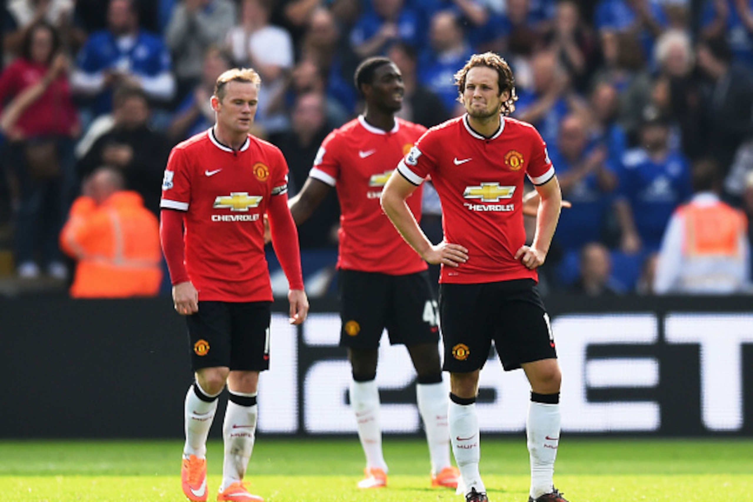 LEICESTER, ENGLAND - SEPTEMBER 21:  (L-R) Dejected Manchester United players Wayne Rooney, Tyler Blackett and Daley Blind look on during the Barclays Premier League match between Leicester City and Manchester United at The King Power Stadium on September 