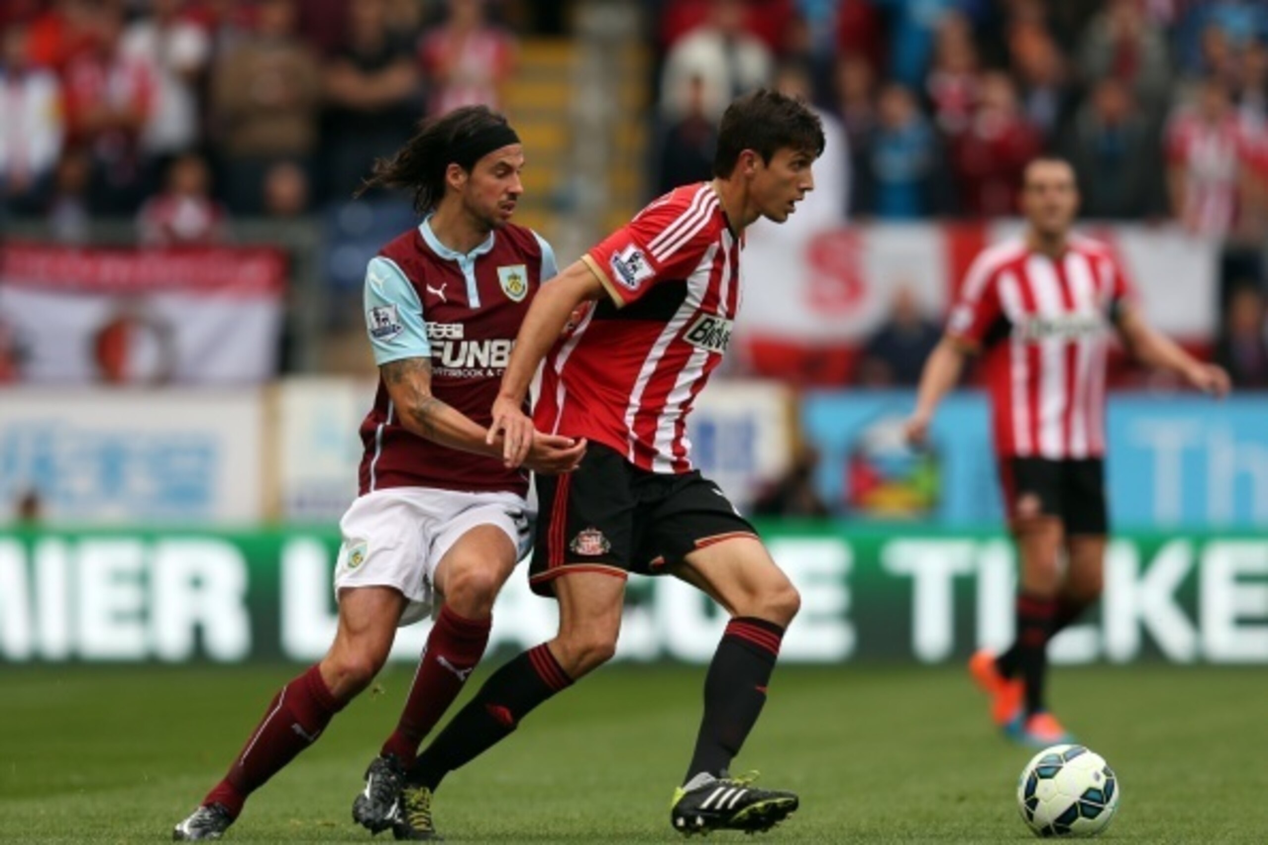 BURNLEY, ENGLAND - SEPTEMBER 20: George Boyd of Burnley in action with Santiago Vergini of Sunderland during the Barclays Premier League match between Burnley and Sunderland at Turf Moor on September 20, 2014 in Burnley, England. (Photo by Chris Brunskill