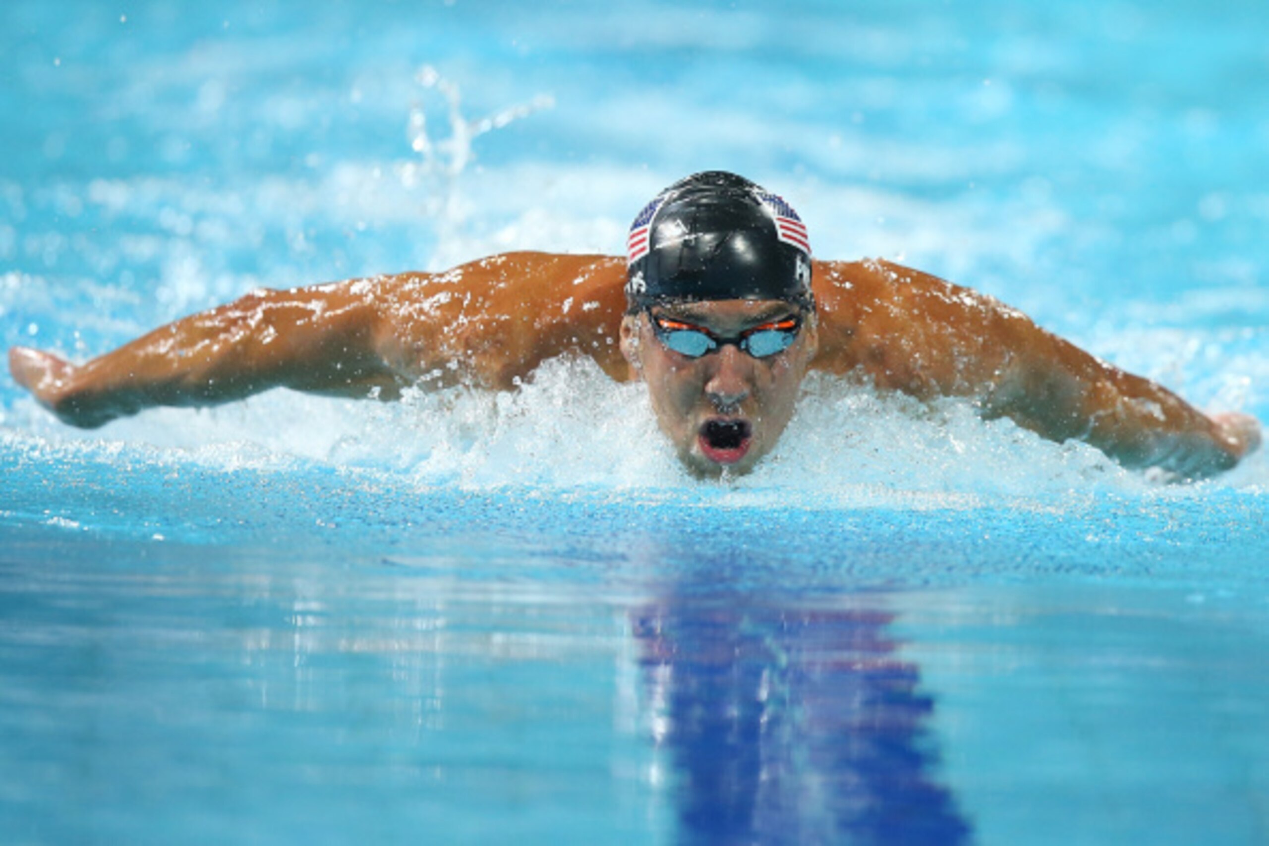 GOLD COAST, AUSTRALIA - AUGUST 24:  Michael Phelps of the USA swims the Men's 200m IM Final during day four of the 2014 Pan Pacific Championships at Gold Coast Aquatics on August 24, 2014 in Gold Coast, Australia.  (Photo by Chris Hyde/Getty Images)