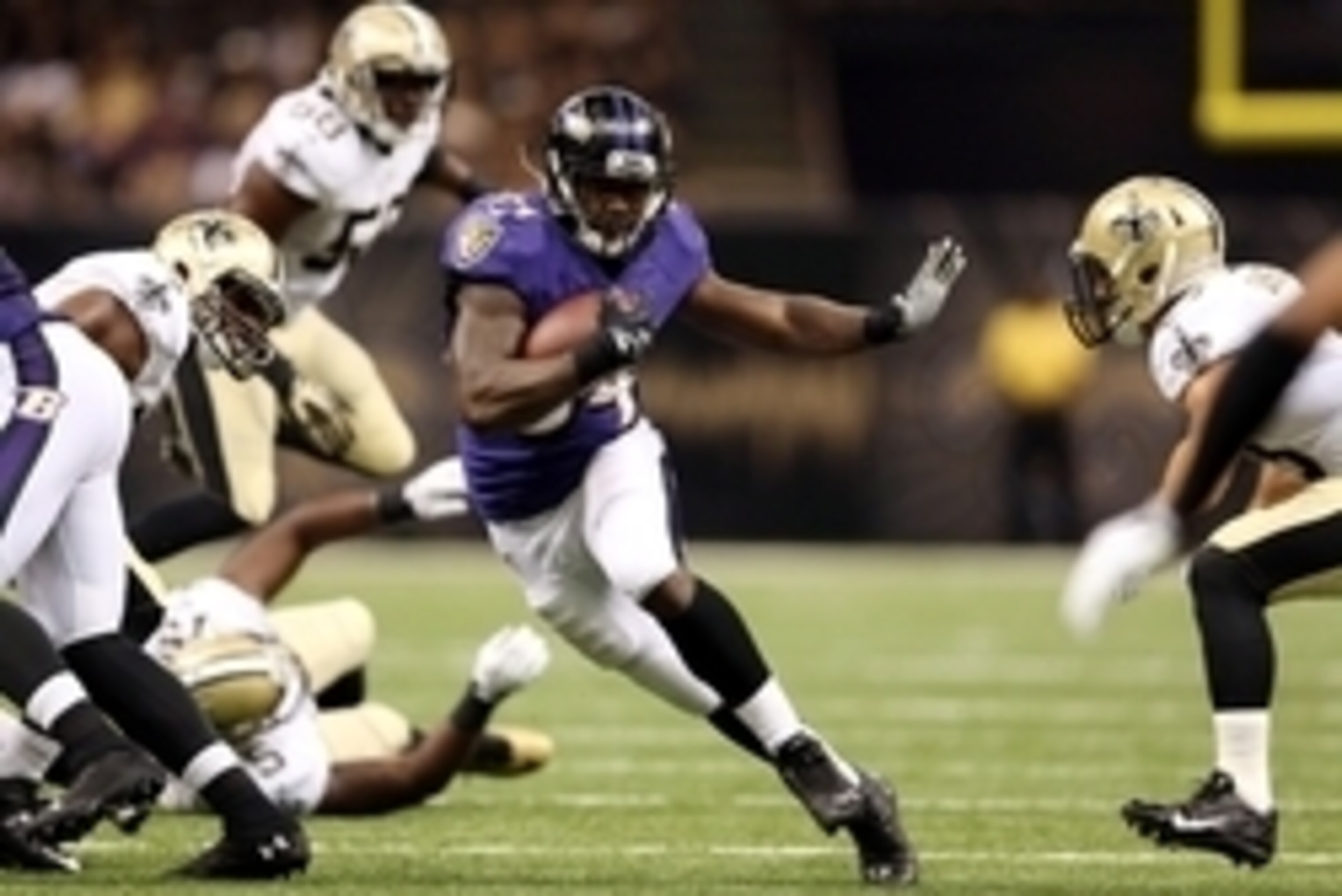 Aug 28, 2014; New Orleans, LA, USA; Baltimore Ravens running back Lorenzo Taliaferro (34) runs through a hole in the New Orleans Saints defense in the second quarter of their game at the Mercedes-Benz Superdome. Mandatory Credit: Chuck Cook-USA TODAY Spor