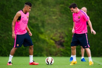 BARCELONA, SPAIN - AUGUST 17: Neymar  (L) and Lionel Messi in action on during a FC Barcelona training session at Ciutat Esportiva on August 17, 2014 in Barcelona, Spain.  (Photo by Alex Caparros/Getty Images)