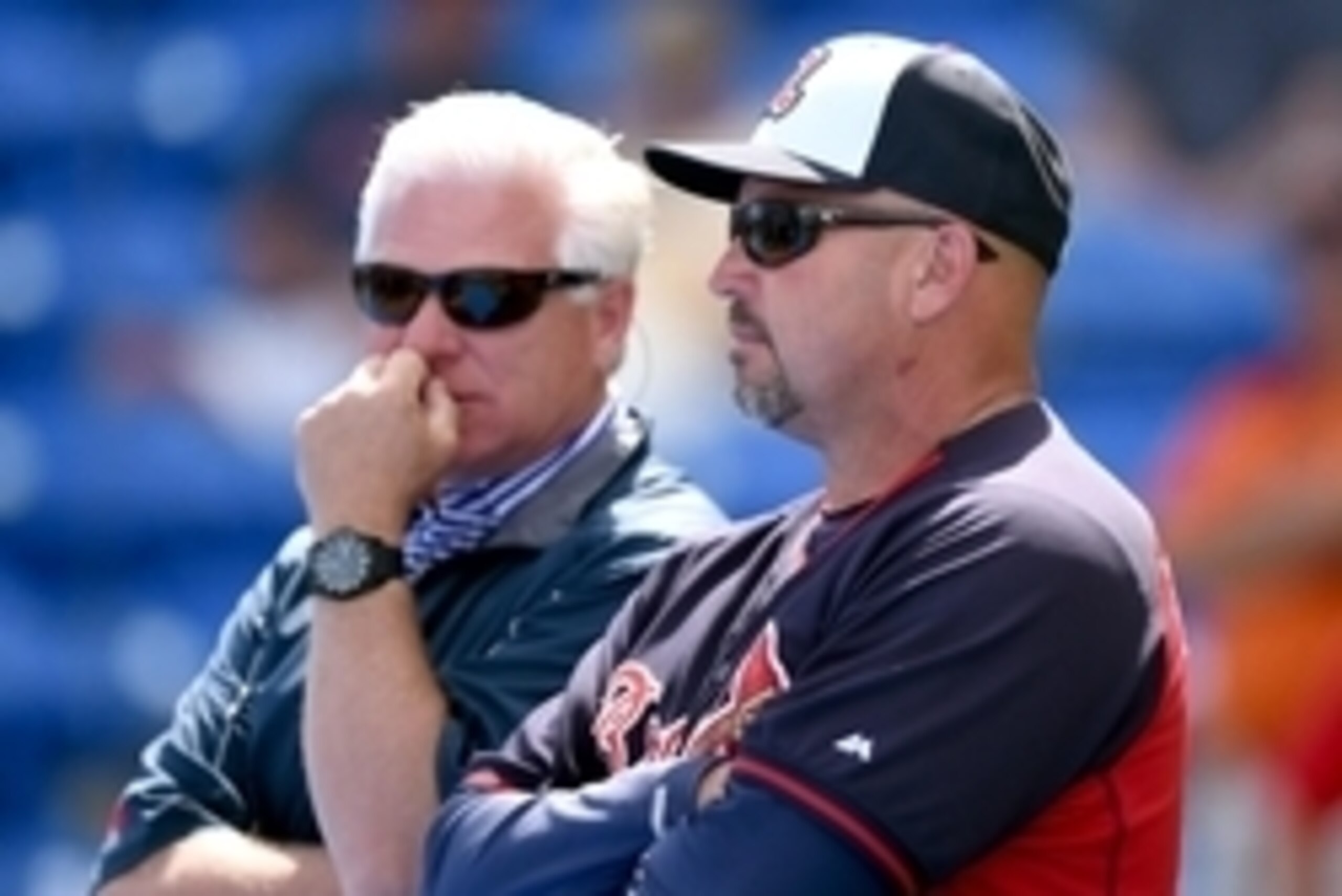 Mar 20, 2014; Port St. Lucie, FL, USA; Atlanta Braves manager Fredi Gonzalez (33) chats with general manager Frank Wren (left) before spring training action against the New York Mets  at Tradition Stadium. Mandatory Credit: Brad Barr-USA TODAY Sports