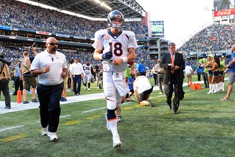 SEATTLE, WA - SEPTEMBER 21: Quarterback Peyton Manning #18 of the Denver Broncos runs off the field after the game against Seattle Seahawks at CenturyLink Field on September 21, 2014 in Seattle,Washington. The Seahawks won the game 26-20. (Photo by Steve 