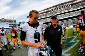 PHILADELPHIA, PA - SEPTEMBER 21:  Quarterback Nick Foles #9 of the Philadelphia Eagles and head coach Chip Kelly of the Philadelphia Eagles walk off the field after their 37-34 win over the Washington Redskins at Lincoln Financial Field on September 21, 2