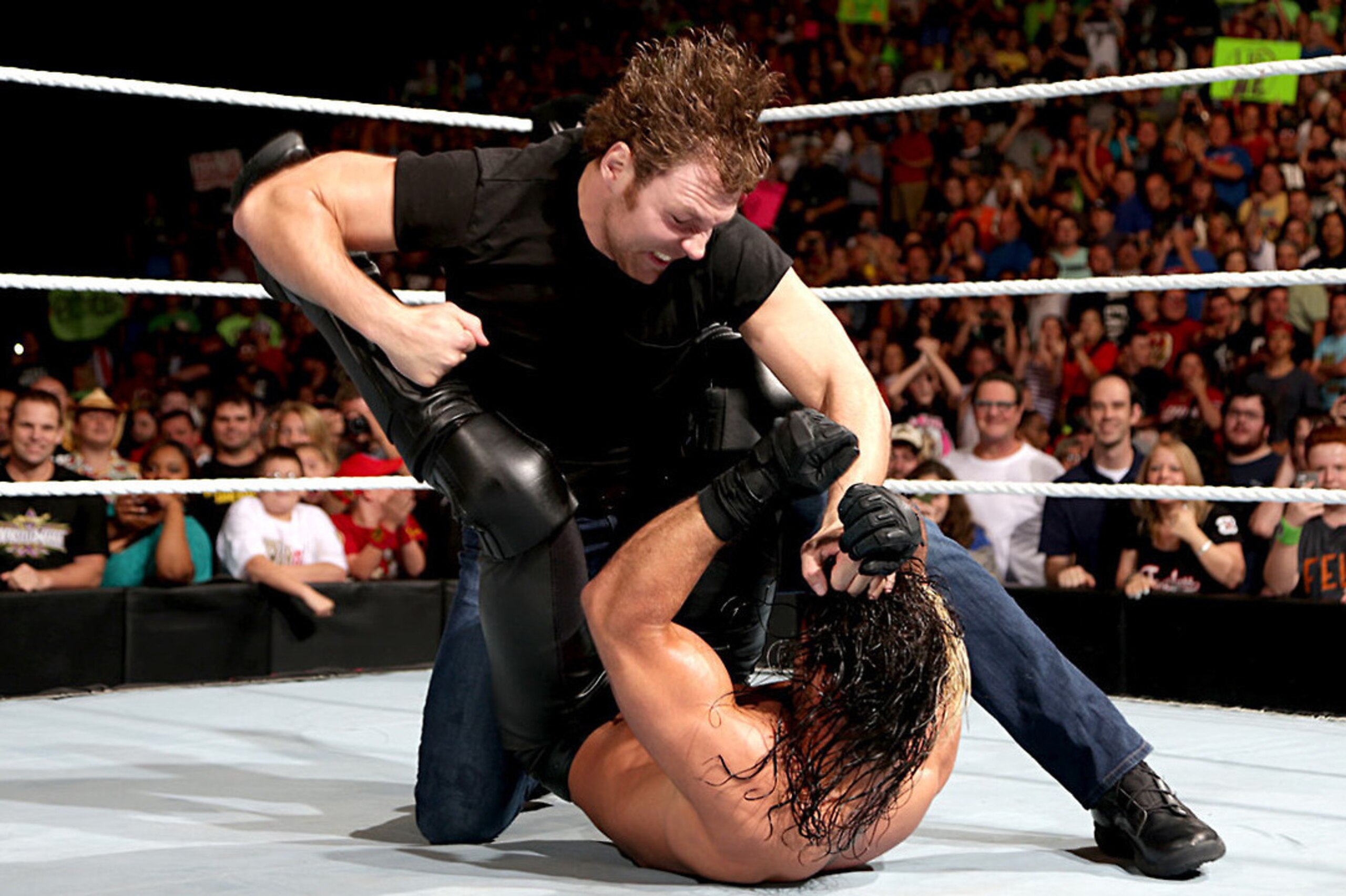 Dean Ambrose attacks Seth Rollins at Night of Champions.