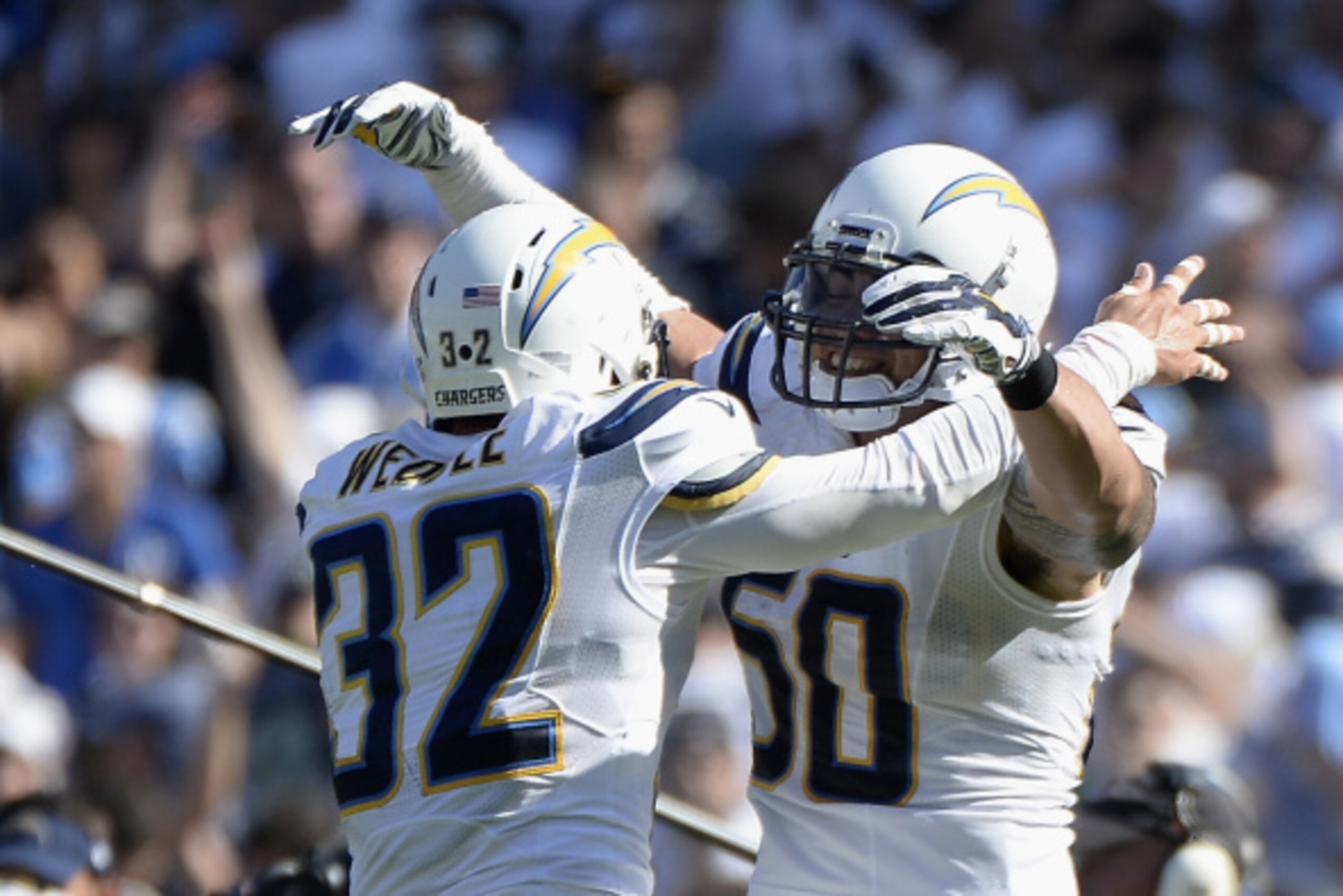 SAN DIEGO, CA - SEPTEMBER 14:  Free safety Eric Weddle #32 celebrates a defensive stop with teammate inside linebacker Manti Te'o #50 of the San Diego Chargers at Qualcomm Stadium on September 14, 2014 in San Diego, California.  (Photo by Harry How/Getty 