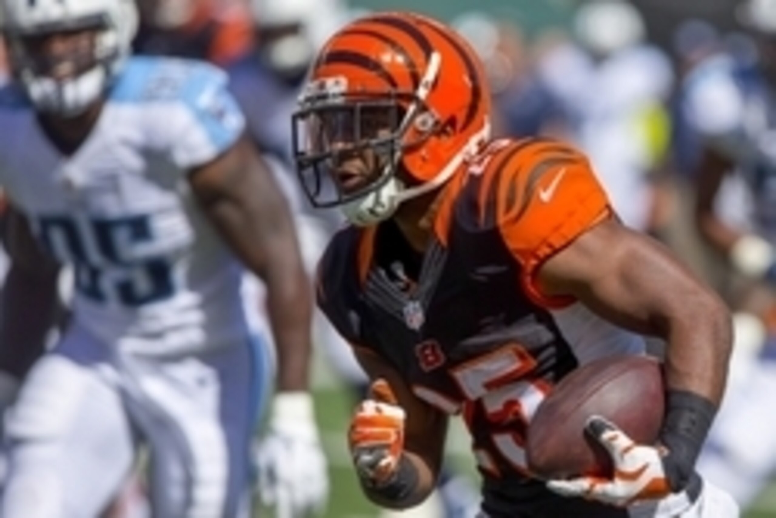 Sep 21, 2014; Cincinnati, OH, USA; Cincinnati Bengals running back Giovani Bernard (25) carries the ball during the second half against the Tennessee Titans at Paul Brown Stadium. The Bengals won 33-7. Mandatory Credit: Aaron Doster-USA TODAY Sports