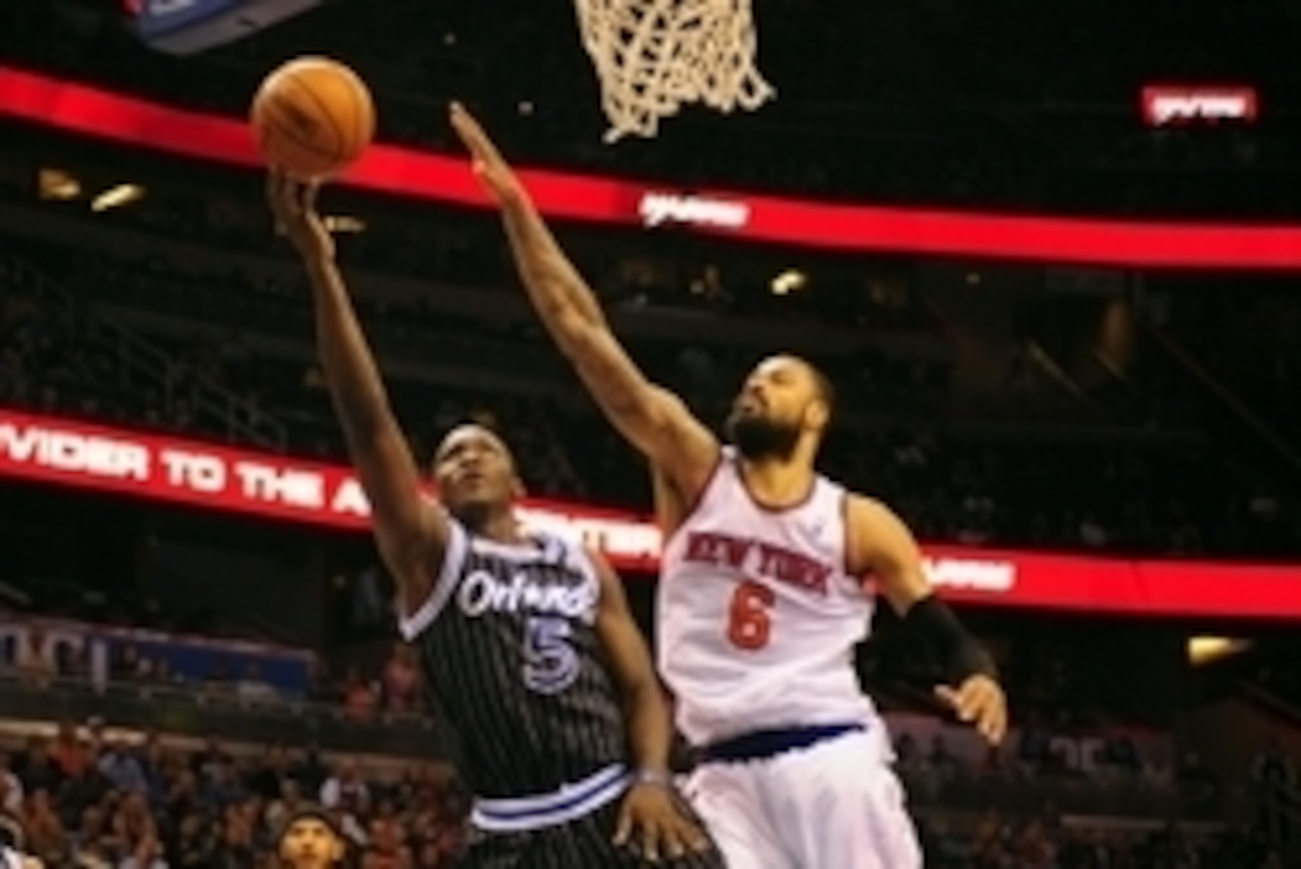 Feb 21, 2014; Orlando, FL, USA; Orlando Magic shooting guard Victor Oladipo (5) drives the lane in front of New York Knicks center Tyson Chandler (6) in double overtime as the Orlando Magic beat the New York Knicks 129-121 in double overtime at Amway Cent