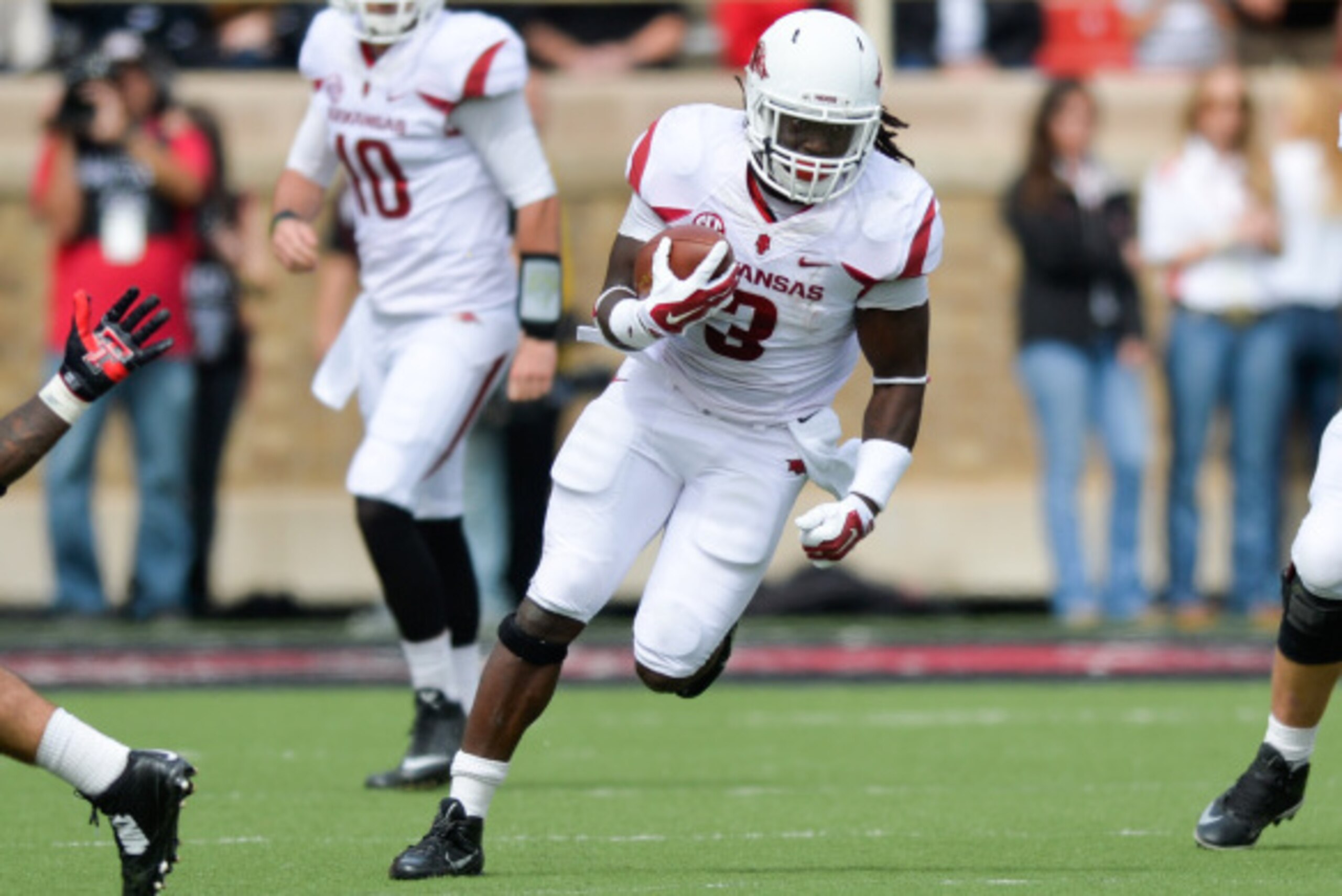 LUBBOCK, TX - SEPTEMBER 13: Alex Collins #3 of the Arkansas Razorbacks runs the ball during game action against the Texas Tech Red Raiders on September 13, 2014 at Jones AT&T Stadium in Lubbock, Texas. Arkansas defeated Texas Tech 49-28. (Photo by John We
