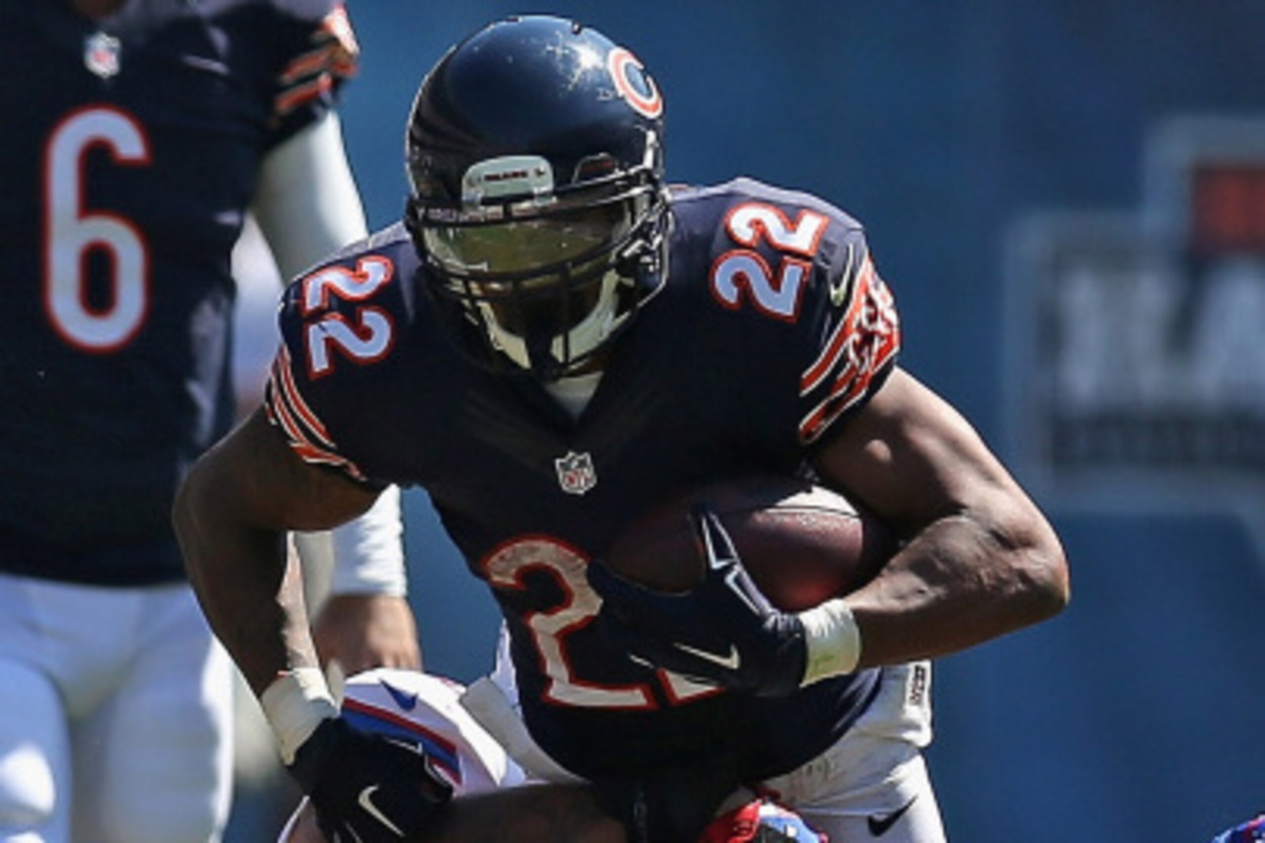 CHICAGO, IL - SEPTEMBER 07:  Matt Forte #22 of the Chicago Bears tries to run past Ty Powell #57 of the Buffalo Bills at Soldier Field on September 7, 2014 in Chicago, Illinois. (Photo by Jonathan Daniel/Getty Images)