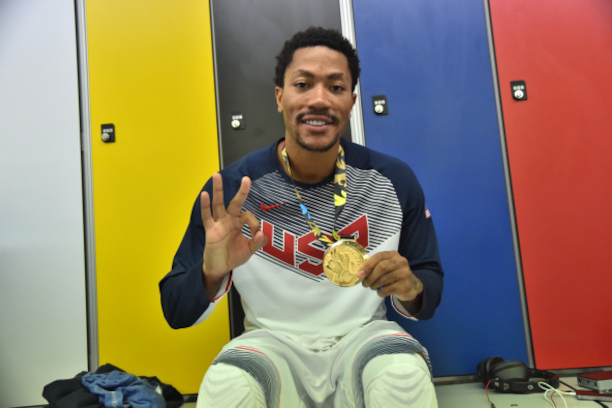 MADRID, SPAIN - SEPTEMBER 14: Derrick Rose #6 of the USA Men's National Team poses for a photo with the gold medal in the locker room after defeating the Serbia National Team during the 2014 FIBA World Cup Finals at Palacio de Deportes on September 14, 20