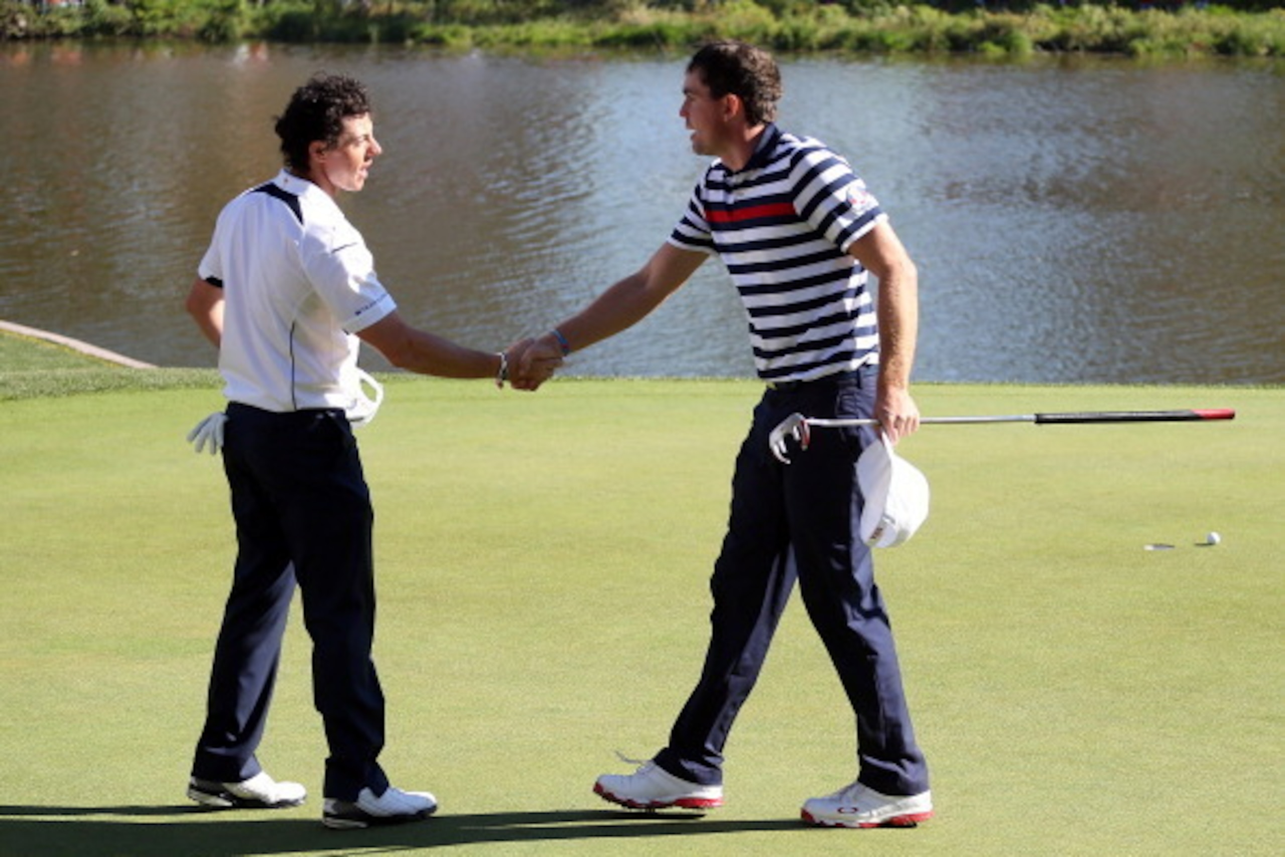 MEDINAH, IL - SEPTEMBER 30:  Rory McIlroy of Europe shakes hands with Keegan Bradley of the USA on the 17th green after defeating Bradley 2&1 during the Singles Matches for The 39th Ryder Cup at Medinah Country Club on September 30, 2012 in Medinah, Illin