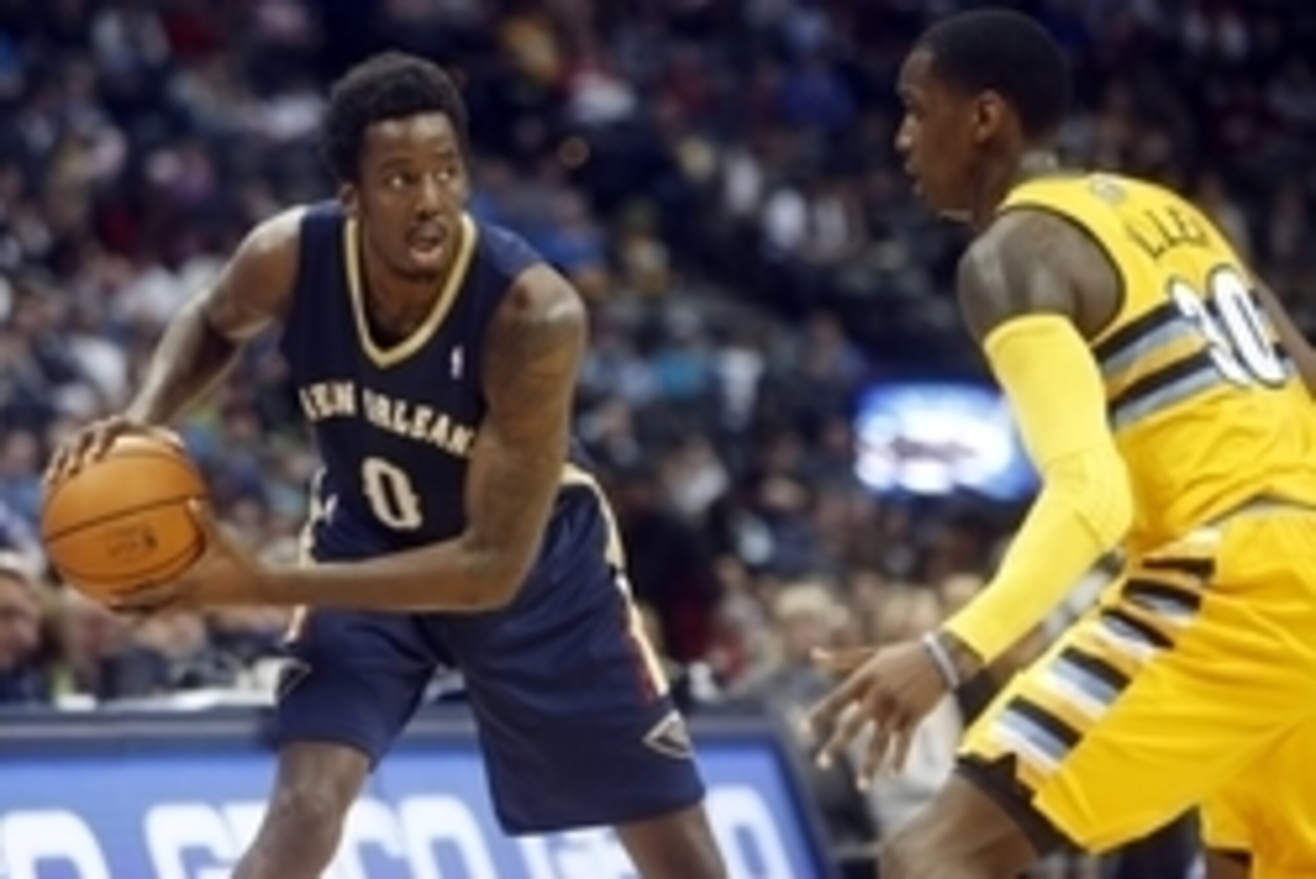 Apr 2, 2014; Denver, CO, USA; New Orleans Pelicans forward Al-Farouq Aminu (0) with the ball against Denver Nuggets forward Quincy Miller (30) during the first half at Pepsi Center. Mandatory Credit: Chris Humphreys-USA TODAY Sports