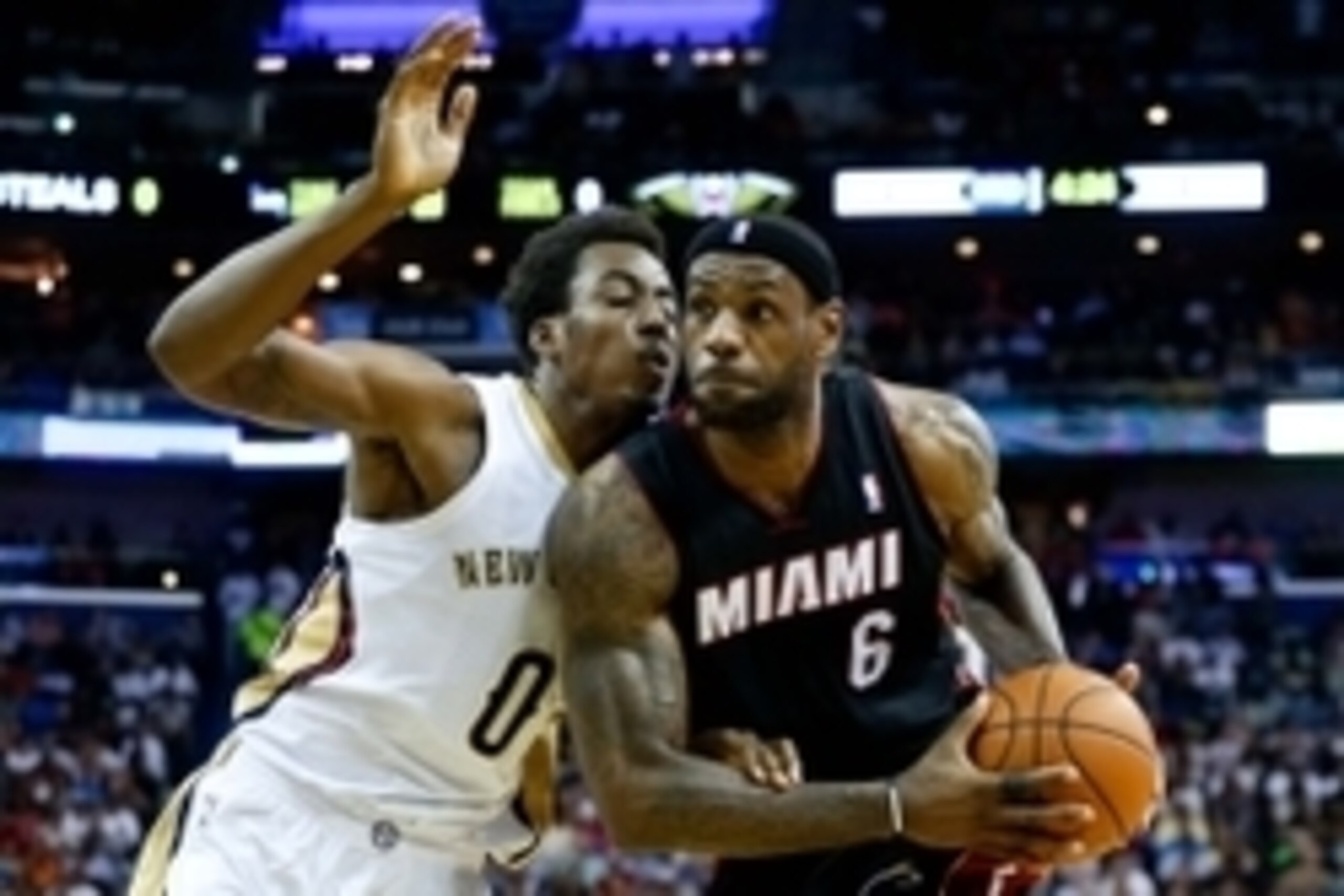 Mar 22, 2014; New Orleans, LA, USA; Miami Heat forward LeBron James (6) drives past New Orleans Pelicans forward Al-Farouq Aminu (0) during the second half of a game at the Smoothie King Center. The Pelicans defeated the Heat 105-95. Mandatory Credit: Der