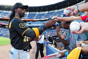 ATLANTA, GA - SEPTEMBER 22: Andrew McCutchen #22 of the Pittsburgh Pirates signs an autograph before the game against the Atlanta Braves at Turner Field on September 22, 2014 in Atlanta, Georgia. (Photo by Scott Cunningham/Getty Images)