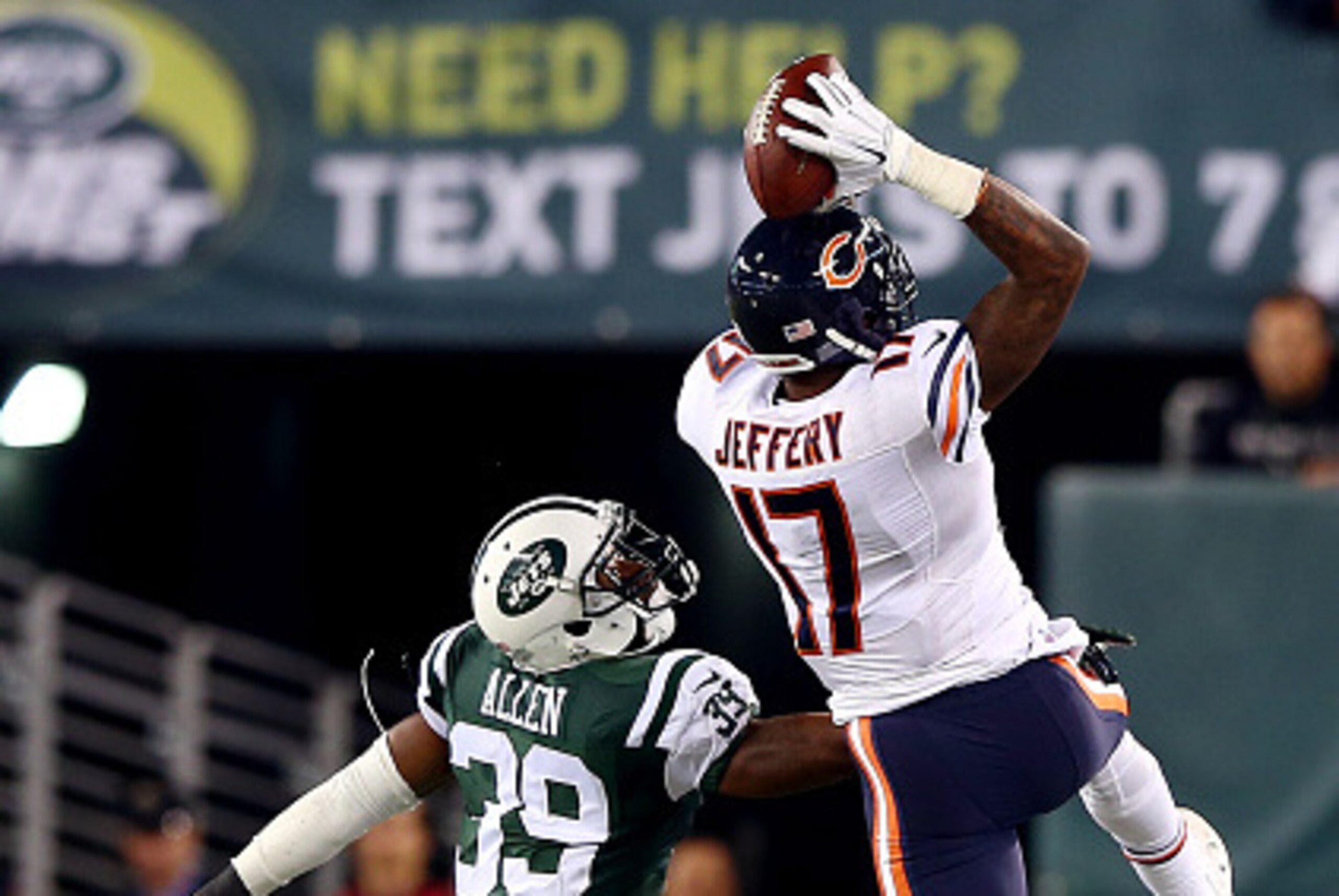 EAST RUTHERFORD, NJ - SEPTEMBER 22: Wide receiver Alshon Jeffery #17 of the Chicago Bears tries to make a catch as free safety Antonio Allen #39 of the New York Jets defends during a game at MetLife Stadium on September 22, 2014 in East Rutherford, New Je