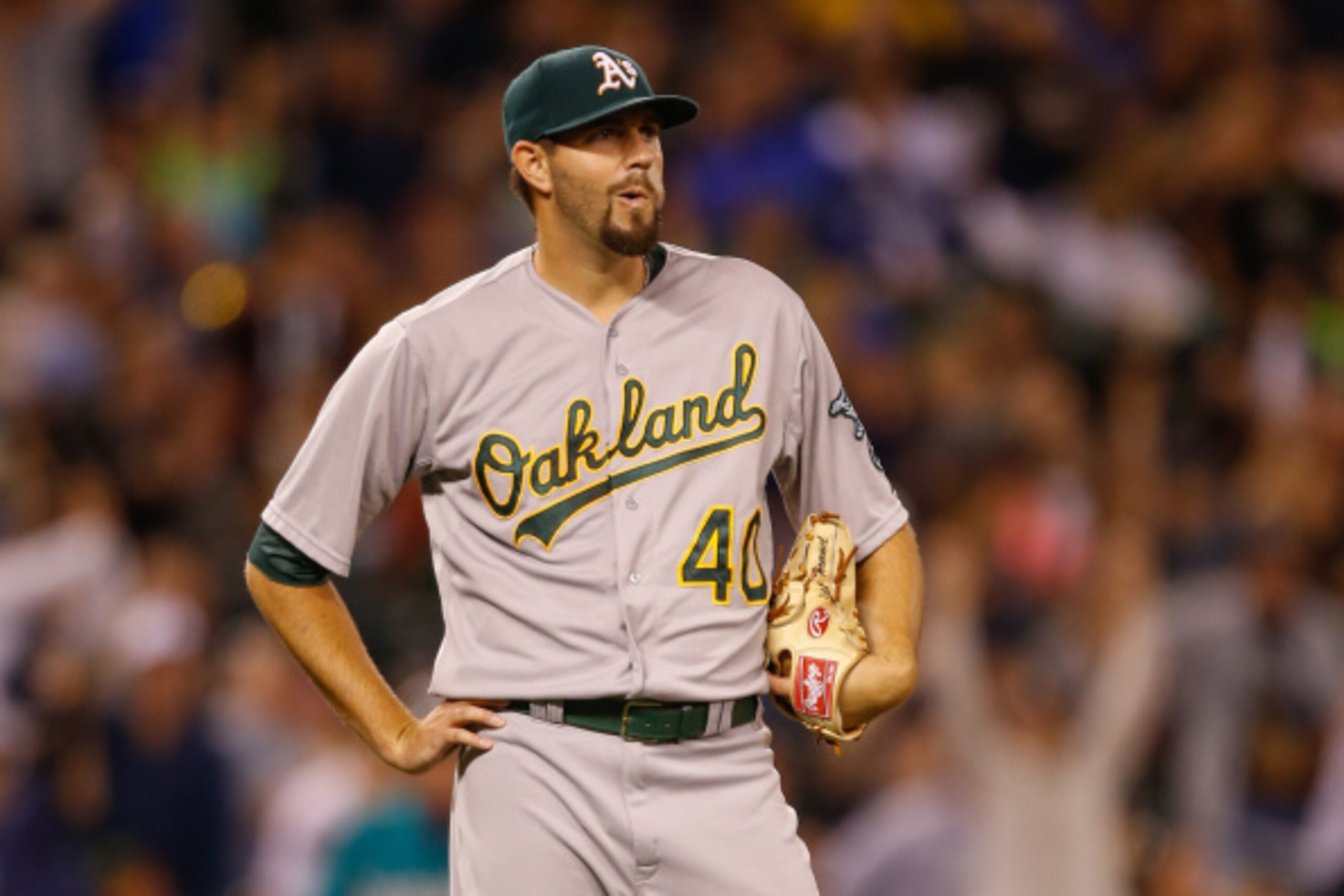 SEATTLE, WA - SEPTEMBER 12:  Starting pitcher Jason Hammel #40 of the Oakland Athletics pauses on the mound after giving up a home run to Logan Morrison of the Seattle Mariners in the fifth inning at Safeco Field on September 12, 2014 in Seattle, Washingt