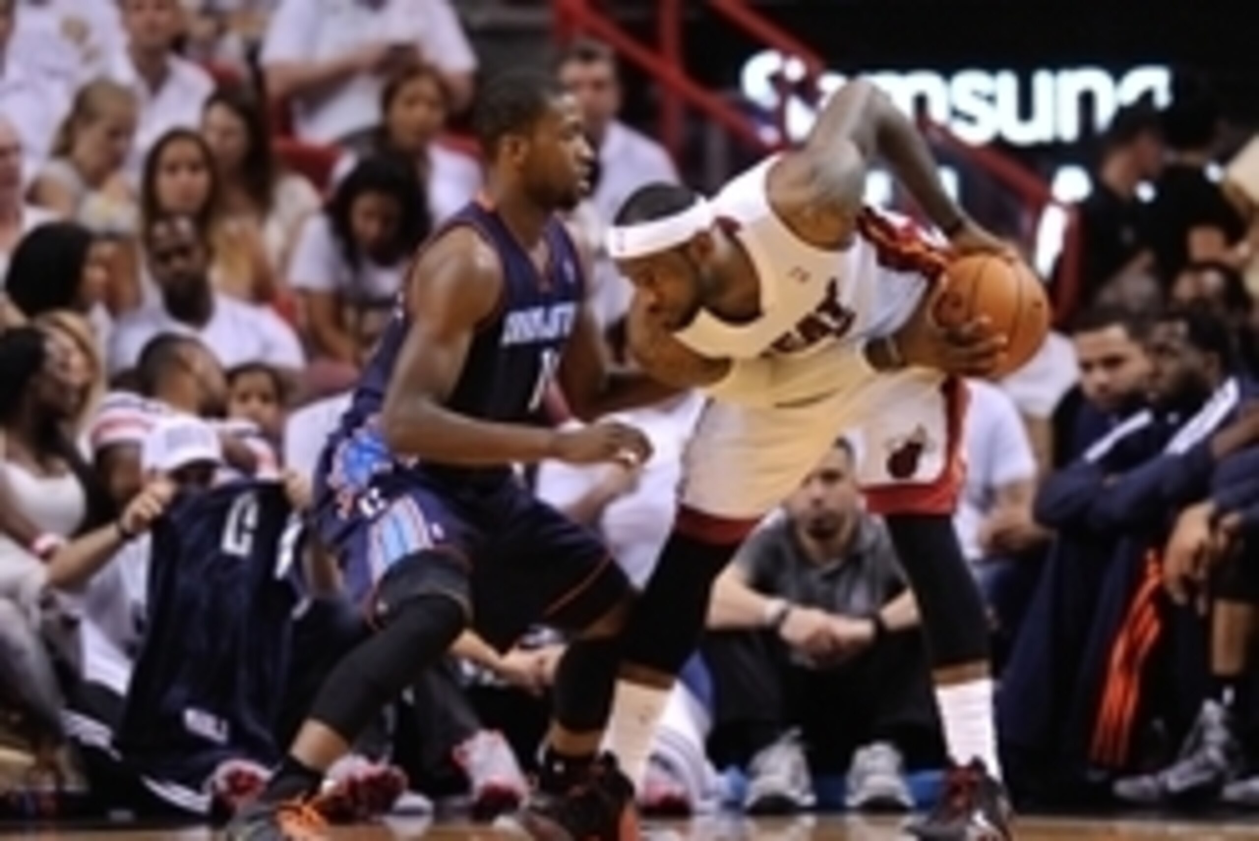Apr 23, 2014; Miami, FL, USA; Miami Heat forward LeBron James (6) is pressured by Charlotte Bobcats forward Michael Kidd-Gilchrist (14) in game two during the first round of the 2014 NBA Playoffs at American Airlines Arena. Mandatory Credit: Steve Mitchel