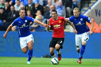 LEICESTER, ENGLAND - SEPTEMBER 21:  Angel di Maria of Manchester United is challenged by Daniel Drinkwater (L) of Leicester City and Ritchie De Laet (R) of Leicester City during the Barclays Premier League match between Leicester City and Manchester Unite