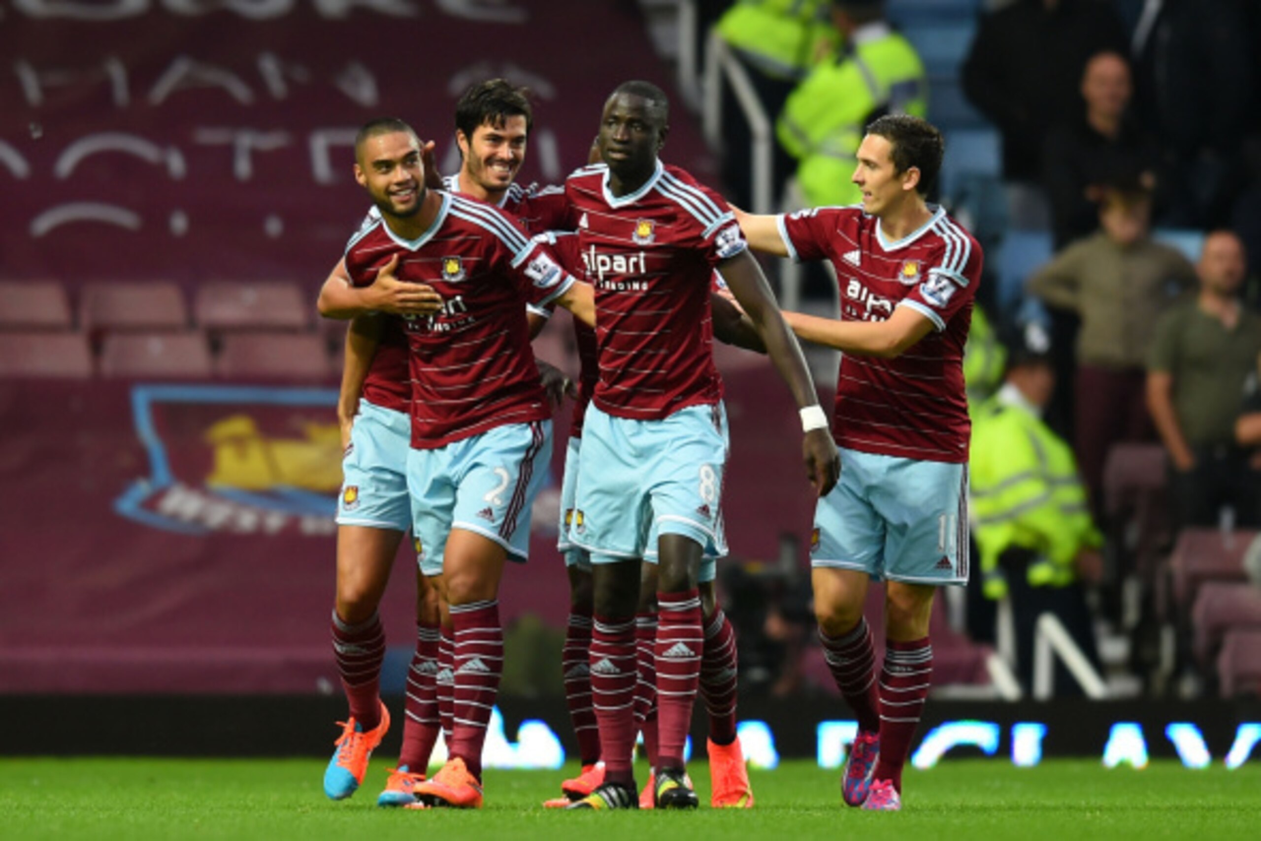 LONDON, ENGLAND - SEPTEMBER 20:  Winston Reid (L) #2 of West Ham is congratulated by teammates after scoring the opening goal during the Barclays Premier League match between West Ham United and Liverpool at Boleyn Ground on September 20, 2014 in London, 