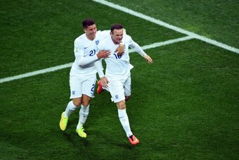 SAO PAULO, BRAZIL - JUNE 19: Wayne Rooney of England (R) celebrates scoring his team's first goal with Ross Barkley during the 2014 FIFA World Cup Brazil Group D match between Uruguay and England at Arena de Sao Paulo on June 19, 2014 in Sao Paulo, Brazi SAO PAULO, BRAZIL - JUNE 19: Wayne Rooney of England (R) celebrates scoring his team's first goal with Ross Barkley during the 2014 FIFA World Cup Brazil Group D match between Uruguay and England at Arena de Sao Paulo on June 19, 2014 in Sao Paulo, Brazi